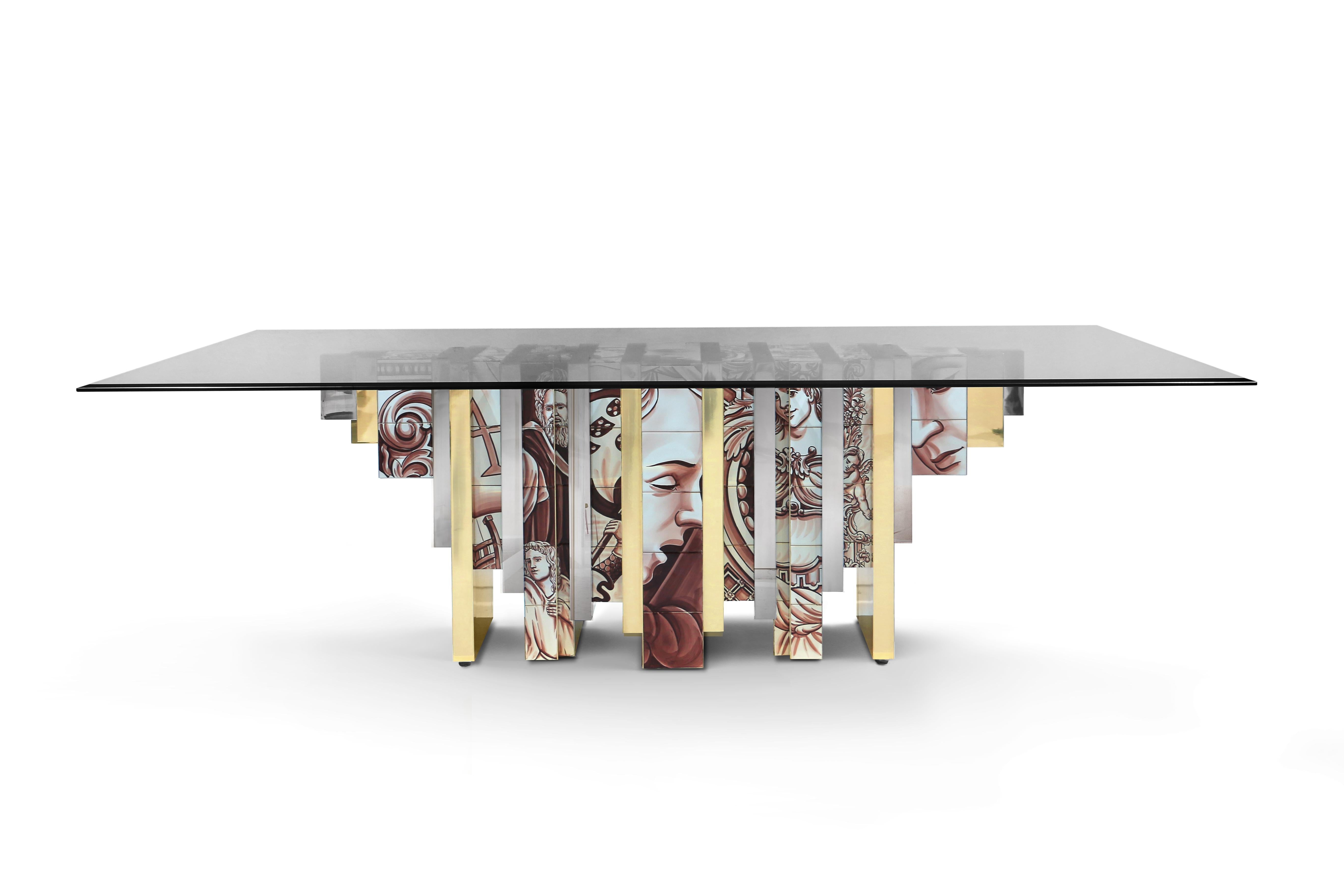 The Heritage Dining Table, much like its sibling Heritage Sideboard and Cabinet, is a highly sophisticated piece inspired by Portuguese history through the use of traditional hand-painted azulejo tiles. Its noble design features bold lines, with