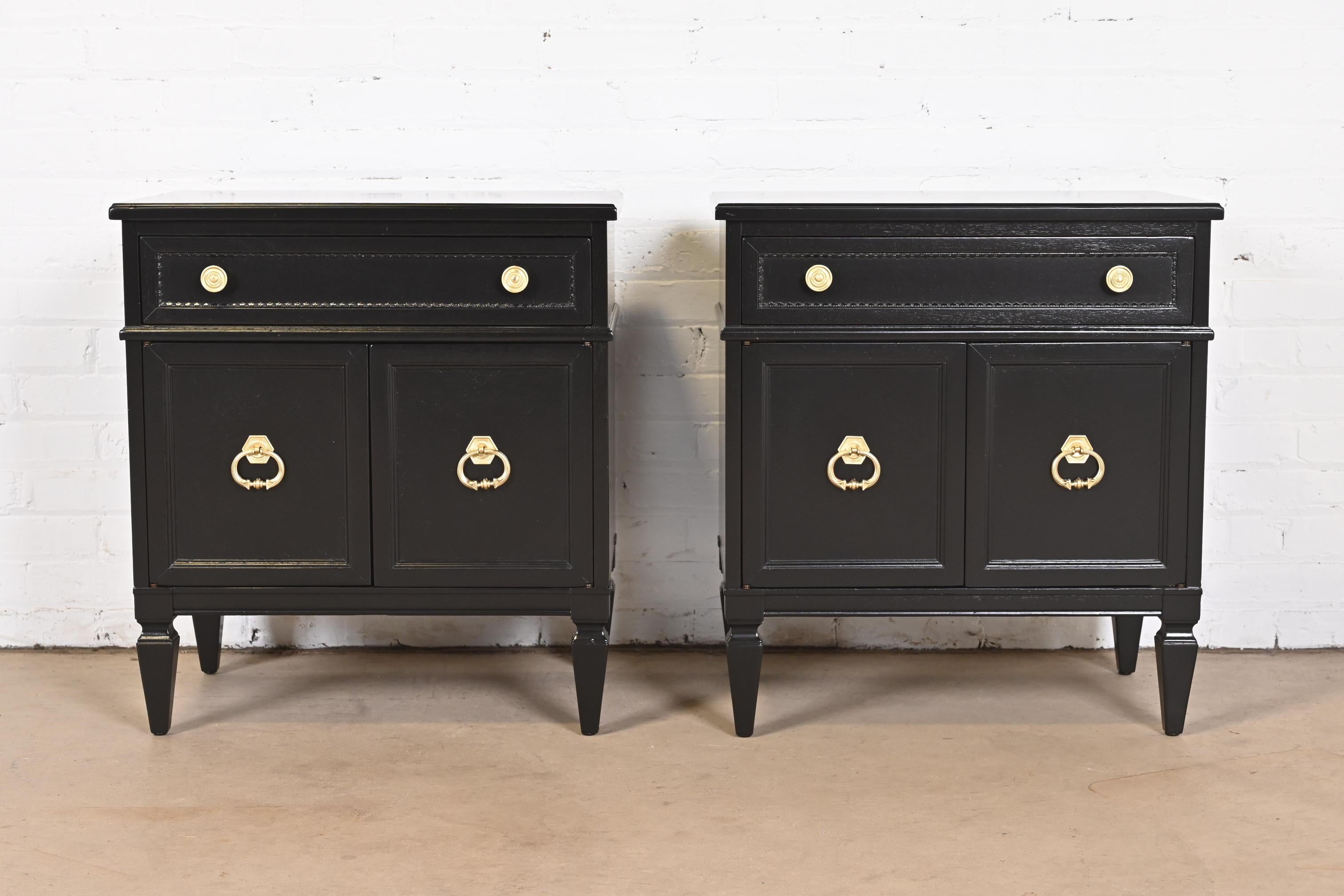 A gorgeous pair of Hollywood Regency style nightstands

By Heritage

USA, Circa 1960s

Black lacquered walnut, with original brass hardware.

Measures: 24