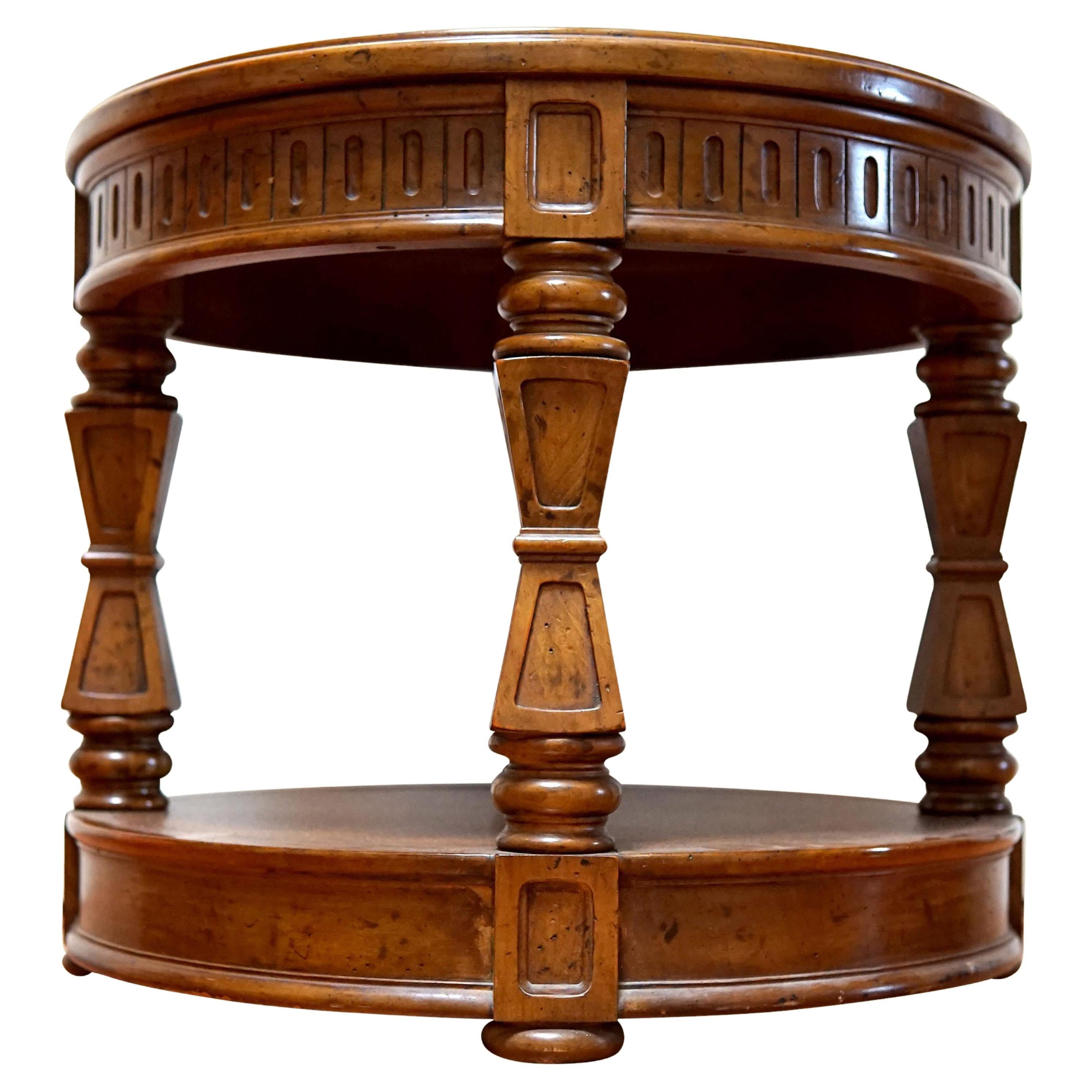 This is a beautiful circular side table marked 