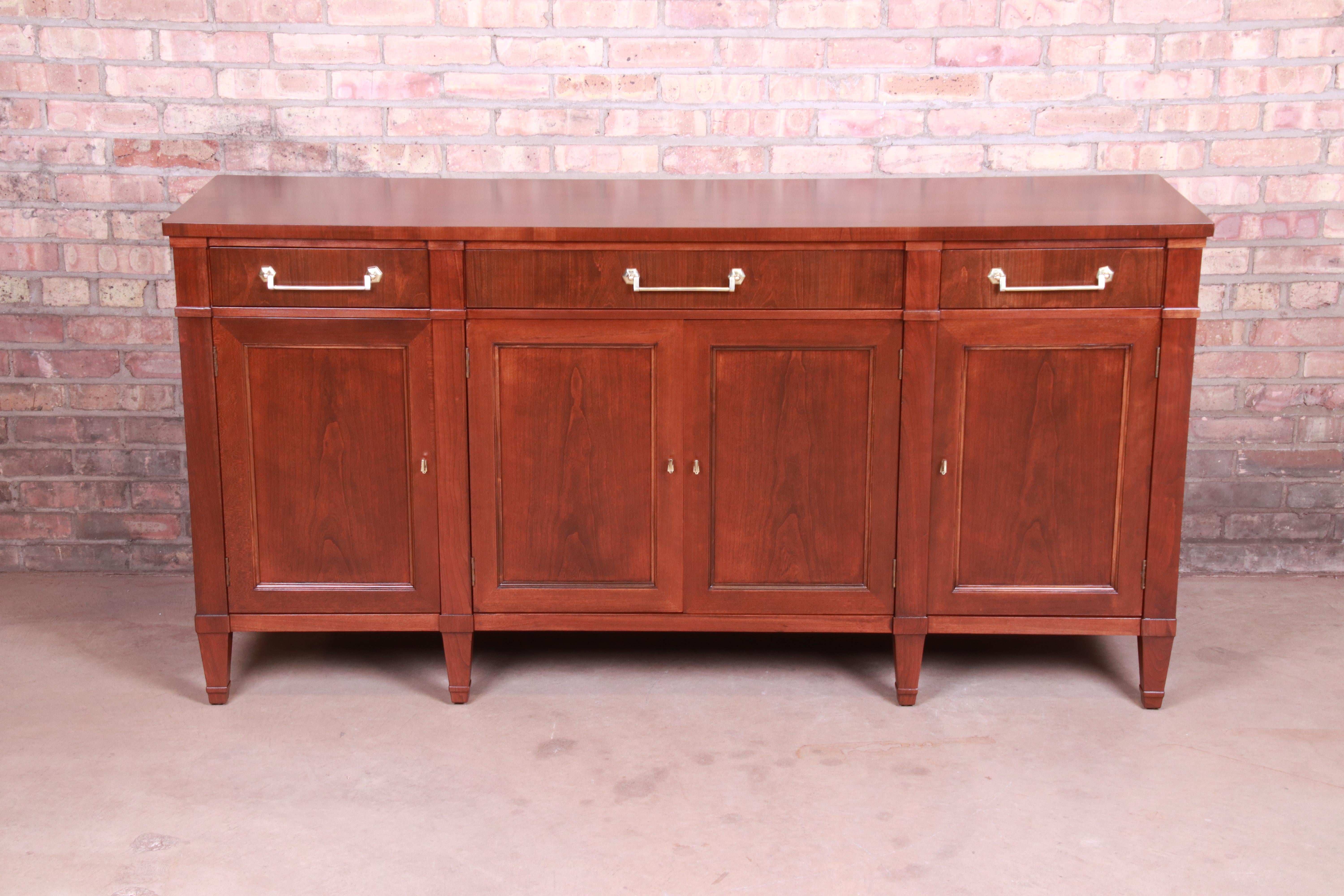 An exceptional midcentury French Regency sideboard credenza or bar cabinet

By Heritage Henredon

USA, circa 1960s

Cherrywood, with original brass hardware.

Measures: 68