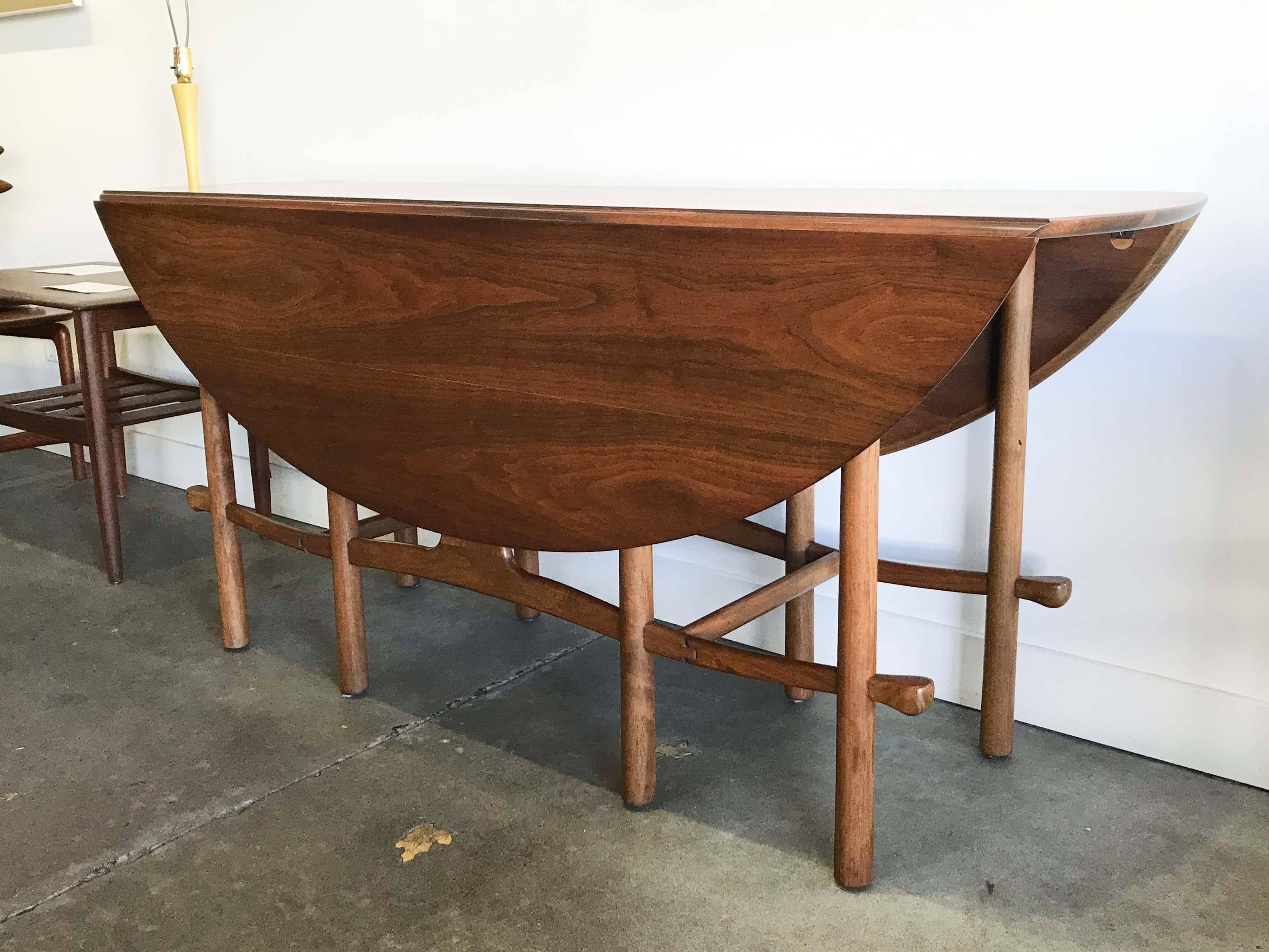 Heritage-Henredon was a collaboration between Drexel Heritage and Henredon Furniture Manufacturers. Approximately 75 designs were made, 40 by Henredon and 35 by Heritage. 

This walnut gate leg table has only had two owners in it's lifetime. It is