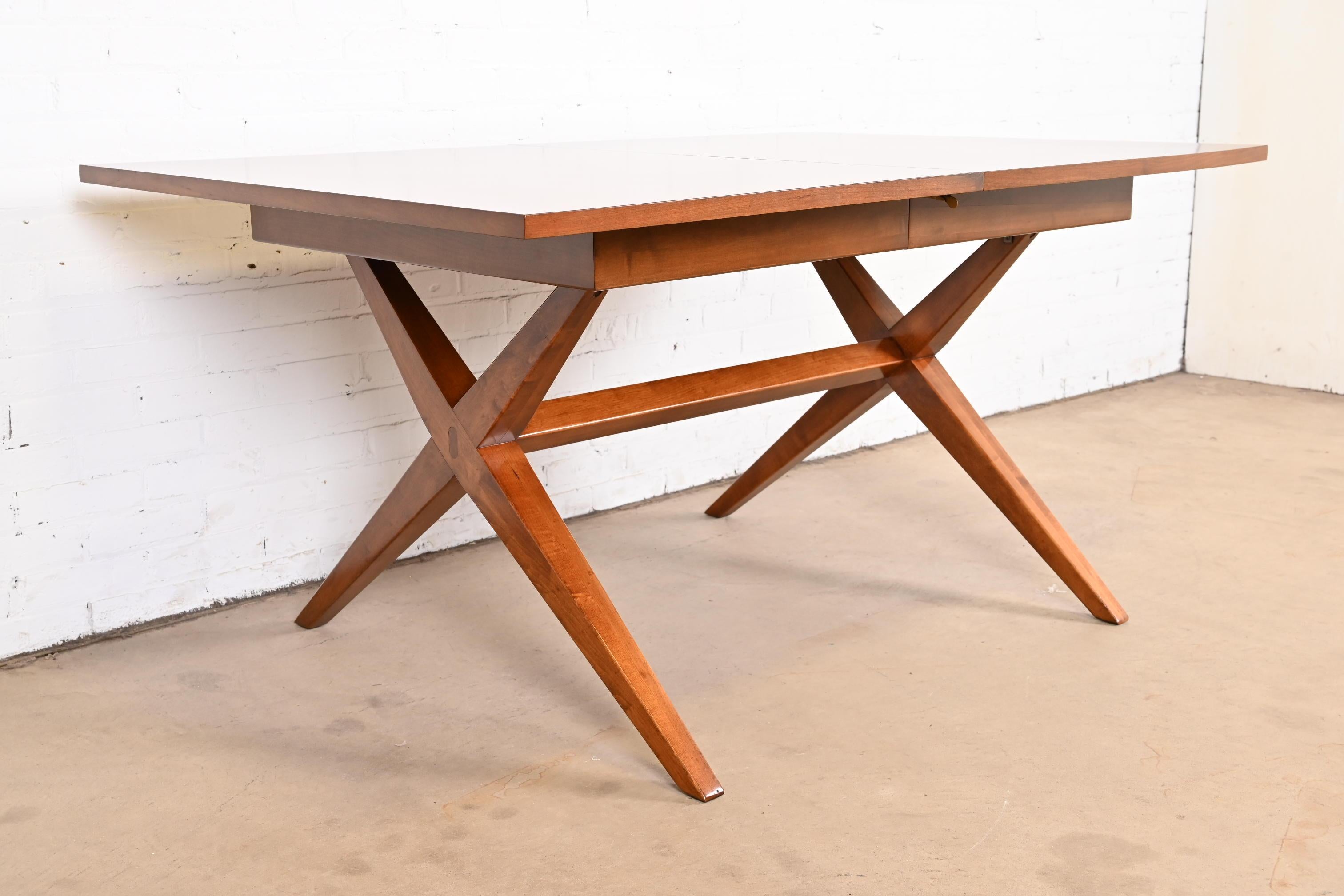 An exceptional Mid-Century Modern x-base extension dining table

In the manner of T.H. Robsjohn-Gibbings

By Heritage-Henredon

USA, 1960s

Gorgeous cherry wood, with inlaid bow ties at each corner.

Measures: 62