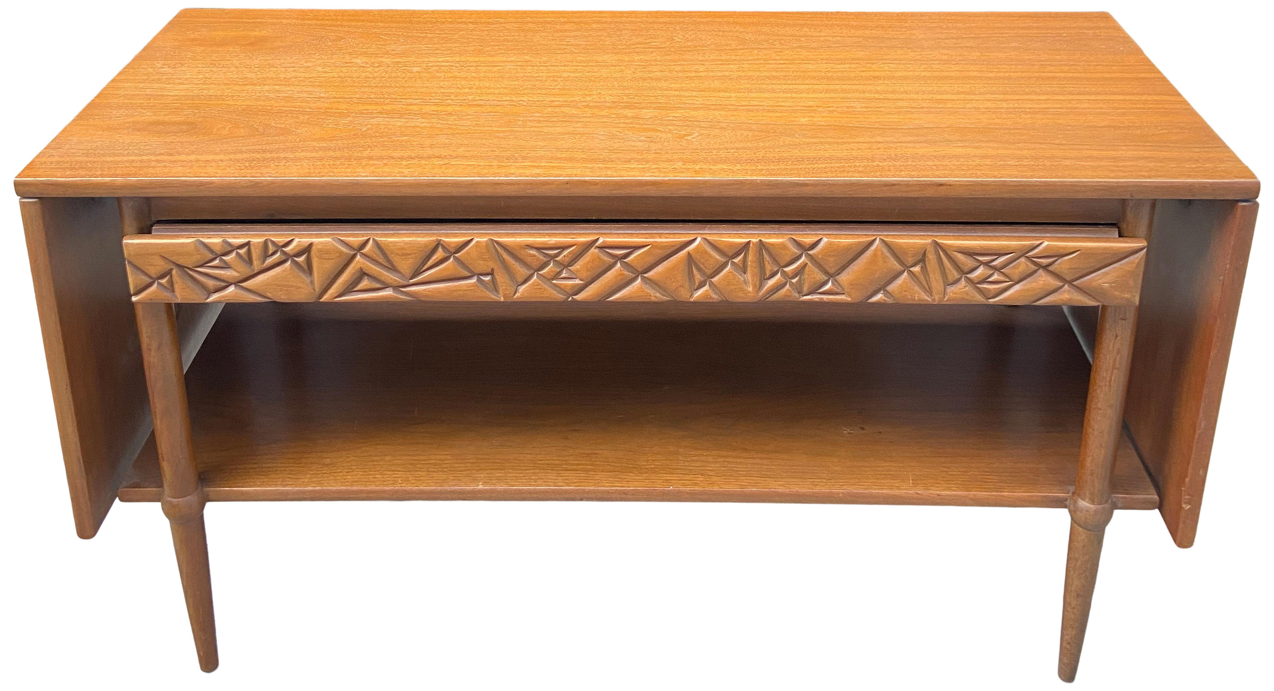 Stylish and functional drop leaf server or console by Henredon. This is piece has the same style as Frank Lloyd Wright's Henredon line. Nicely made and practical piece with beautiful sculpted (almost brutalist) drawer front details. Made from
