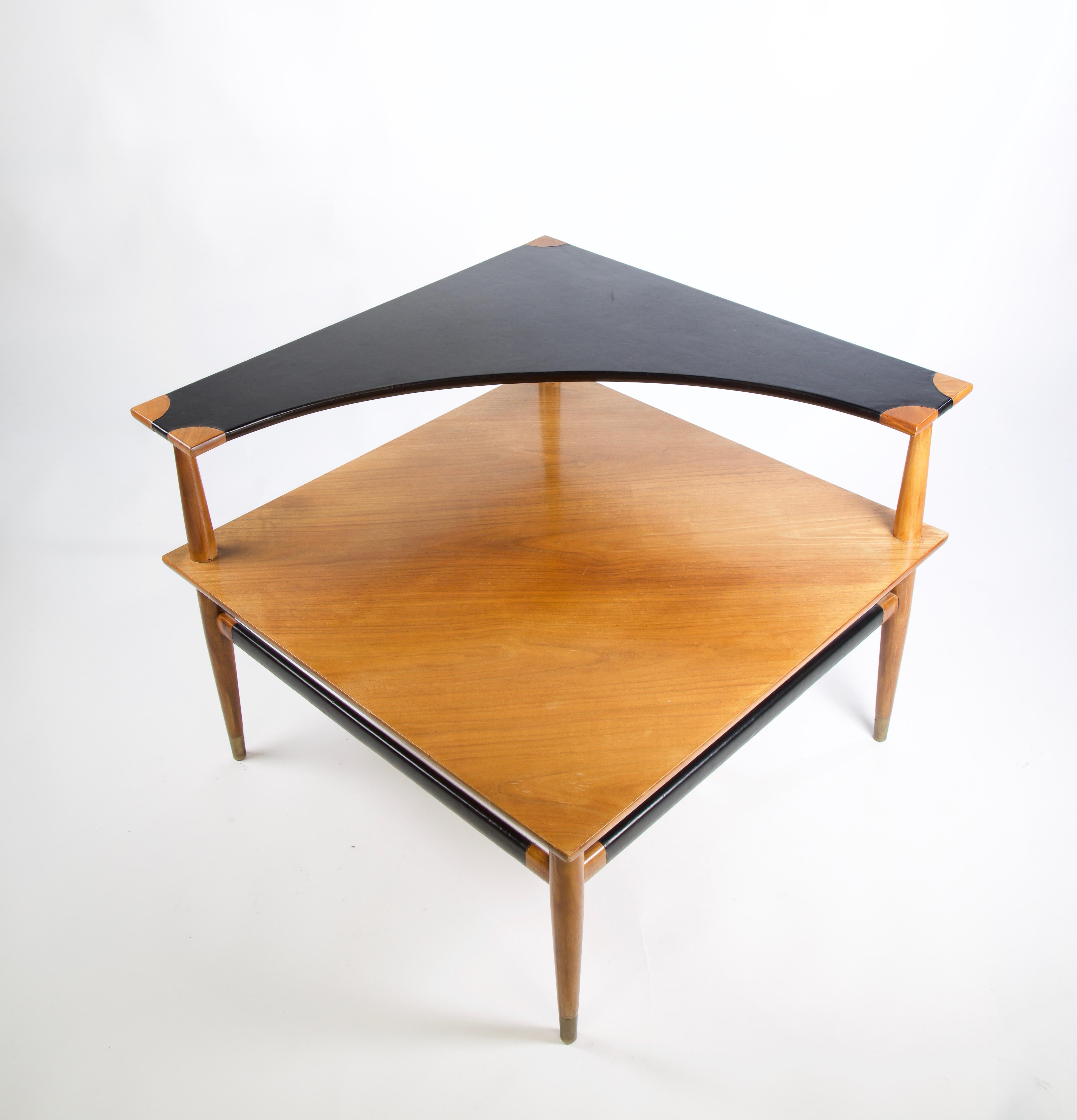 Heritage Henredon corner side table with a black leather top and leather stretchers. The table has been refinished with the leather being dyed black. 

Heritage-Henredon was a cross-licensing venture between Drexel Heritage and Henredon furniture