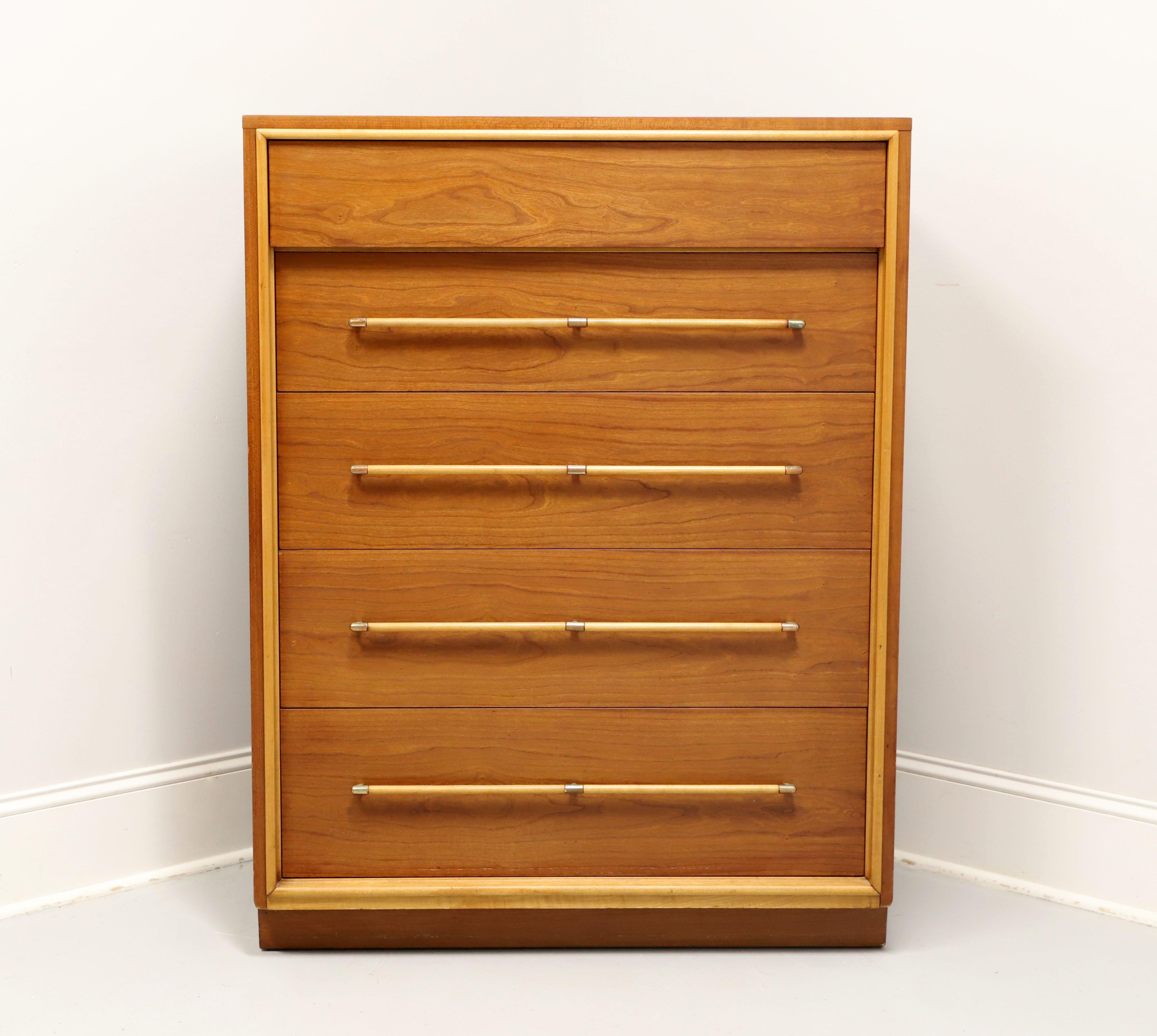 A Mid 20th Century Modern style chest of drawers by Heritage Henredon, a collaboration between Henredon and Drexel Heritage. Walnut with brass & walnut hardware, solid edge to the top, slightly recessed inward lower drawers, and a solid base.