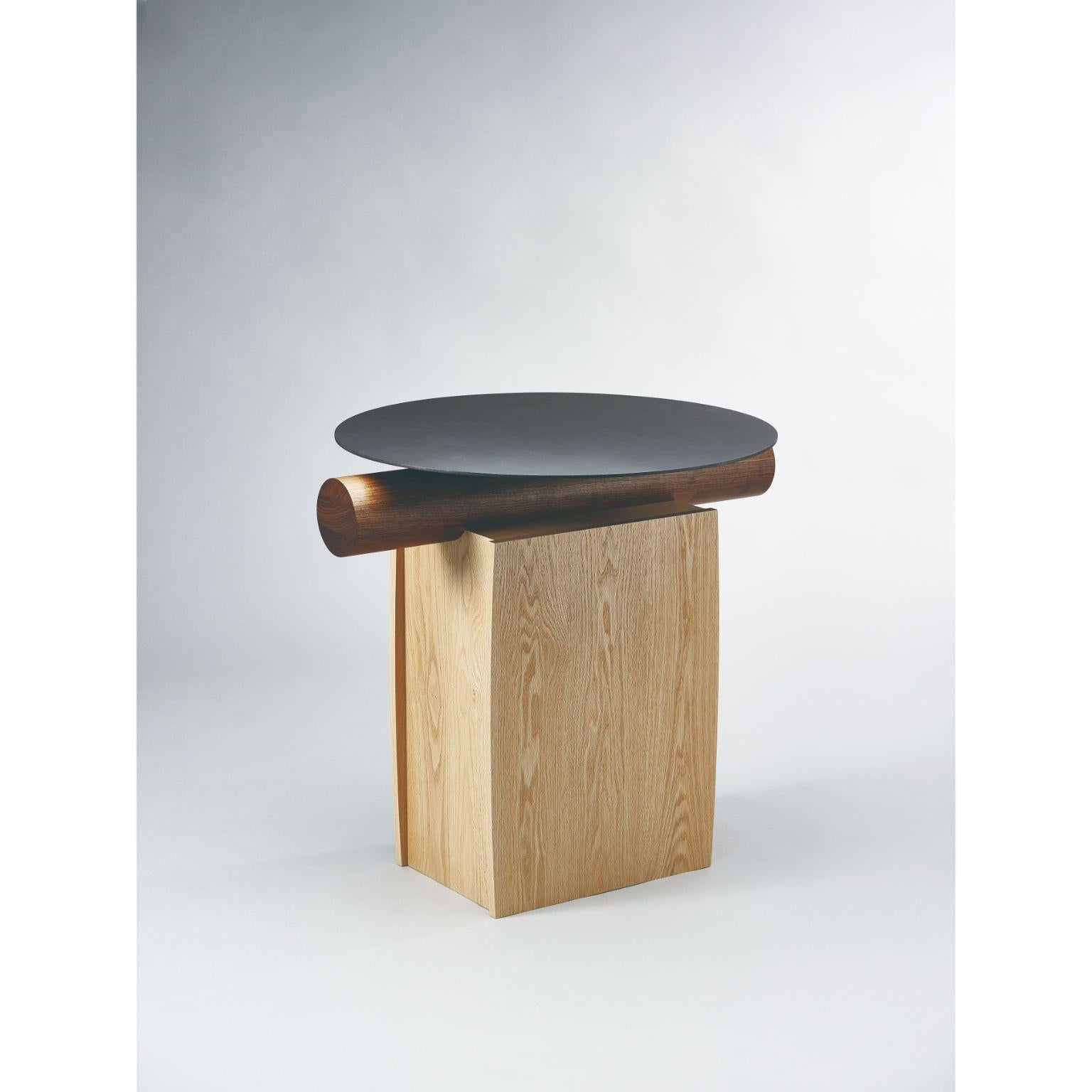 Heritage round table by Lee Jung Hoon
Dimensions: D 80 x W 70 x H 472.4 cm
Materials: Red oak, walnut, stainless steel, Corrosion

The Heritage series, created by designer Lee Jung-hoon is a collection of sculptural modern furniture. The designs