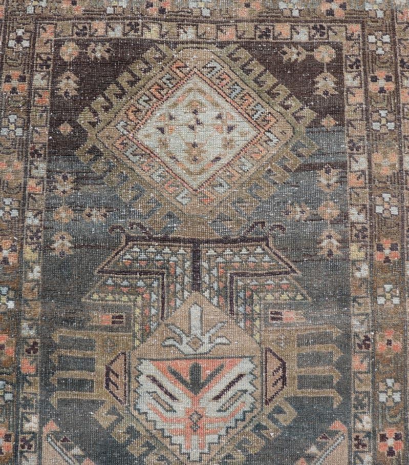 Heriz Antique Persian Rug with Geometric Medallions in Steal Blue, Brown & Peach. Keivan Woven Arts / rug EMB-22204-15460, country of origin / type: Iran / Heriz Serapi, circa 1900
Measures: 3'1 x 13'10 
This magnificent Heriz  runner woven in the