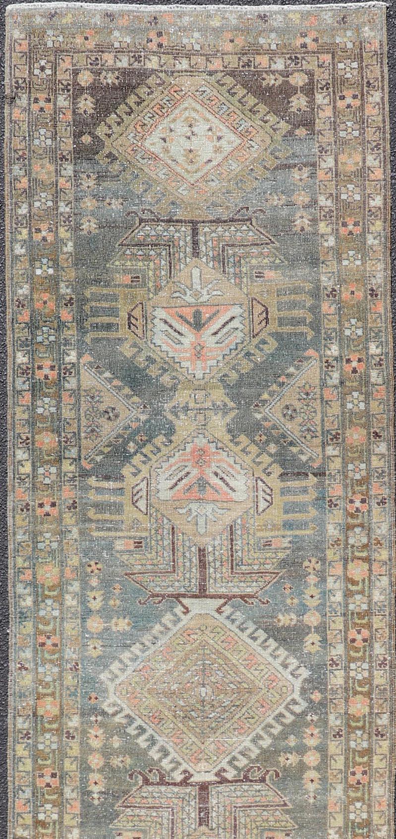 Hand-Knotted Heriz Antique Persian Rug with Geometric Medallions in Steal Blue, Brown & Peach For Sale