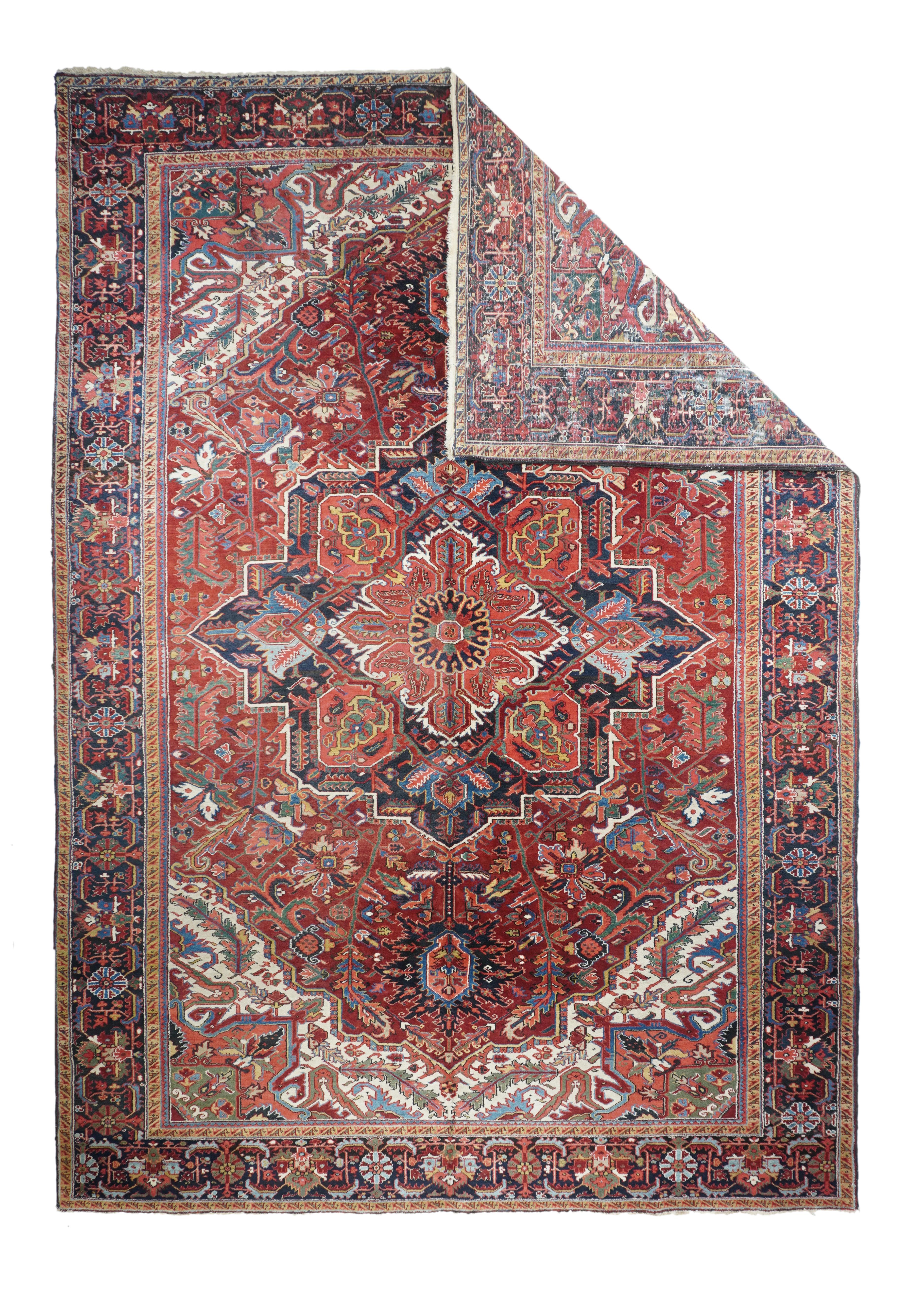 This good condition, cotton foundation, moderately coarsely woven NW Persian village carpet displays a characteristic warm red field centred by a navy octogramme with every second point beveled and pending navy ragged palmettes. Torn and barbed