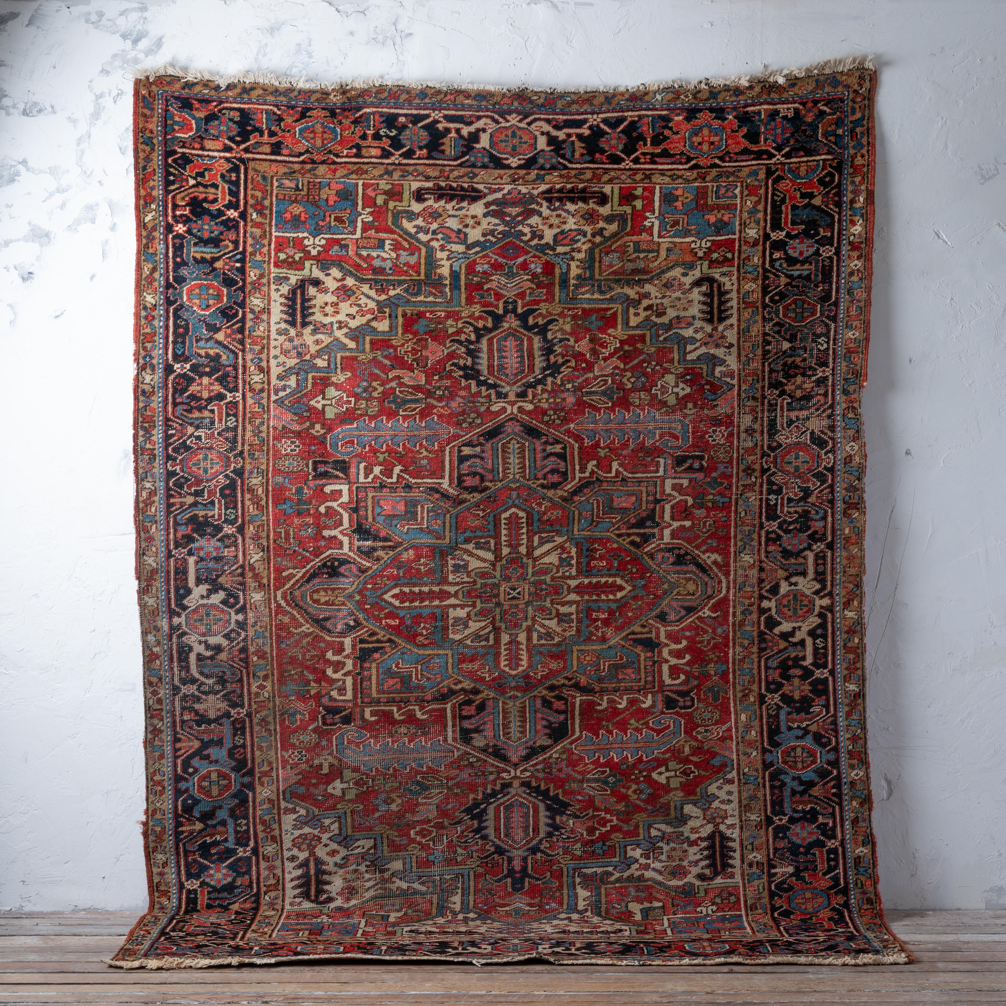 A Persian Heriz rug, circa 1920s.

76 by 105 inches


