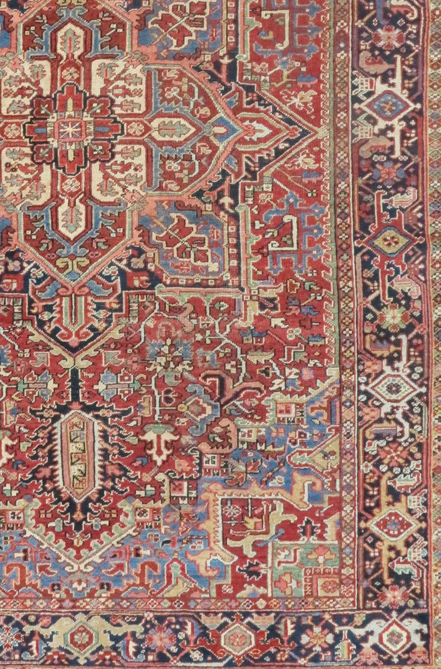 Persian Heriz rug from the early 20th century. Measures 7'7