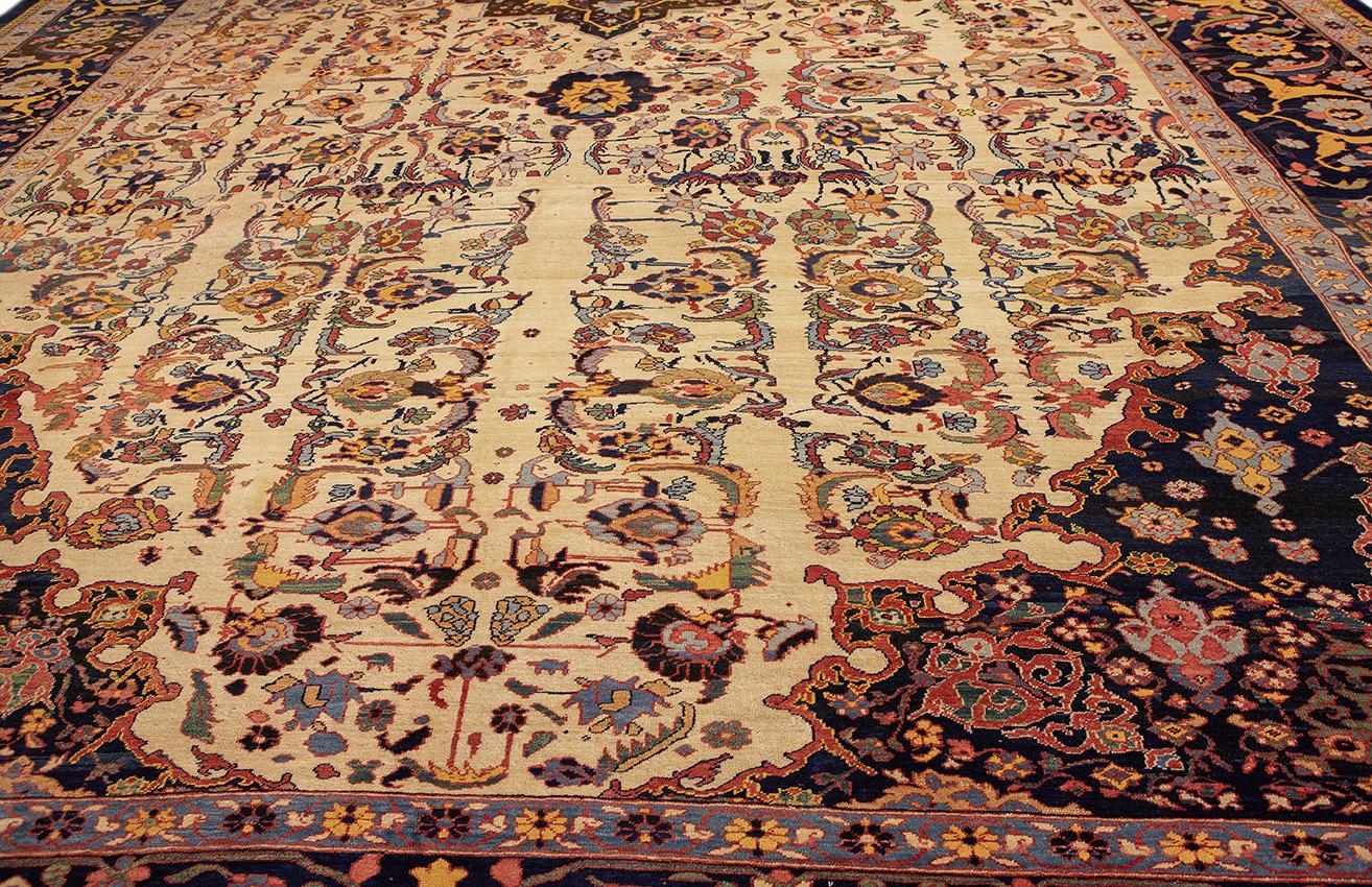 An unusual antique Heriz rug.
This is an extraordinary antique Heriz rug, a true masterpiece of weaving artistry. Measuring approximately 713cm x 455cm, this rug commands attention with its captivating design and impeccable craftsmanship.
The light