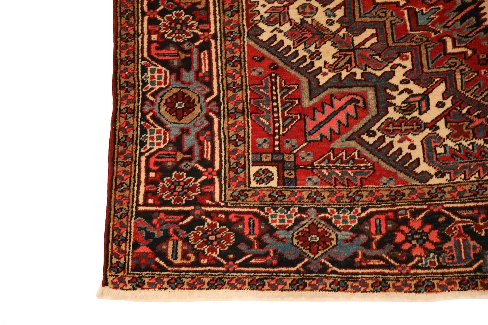 Introducing the Heriz Rug, an exquisite masterpiece that encapsulates the timeless allure of Heriz craftsmanship. This captivating rug unfolds on a rich red background, serving as the perfect canvas for a majestic medallion that commands attention