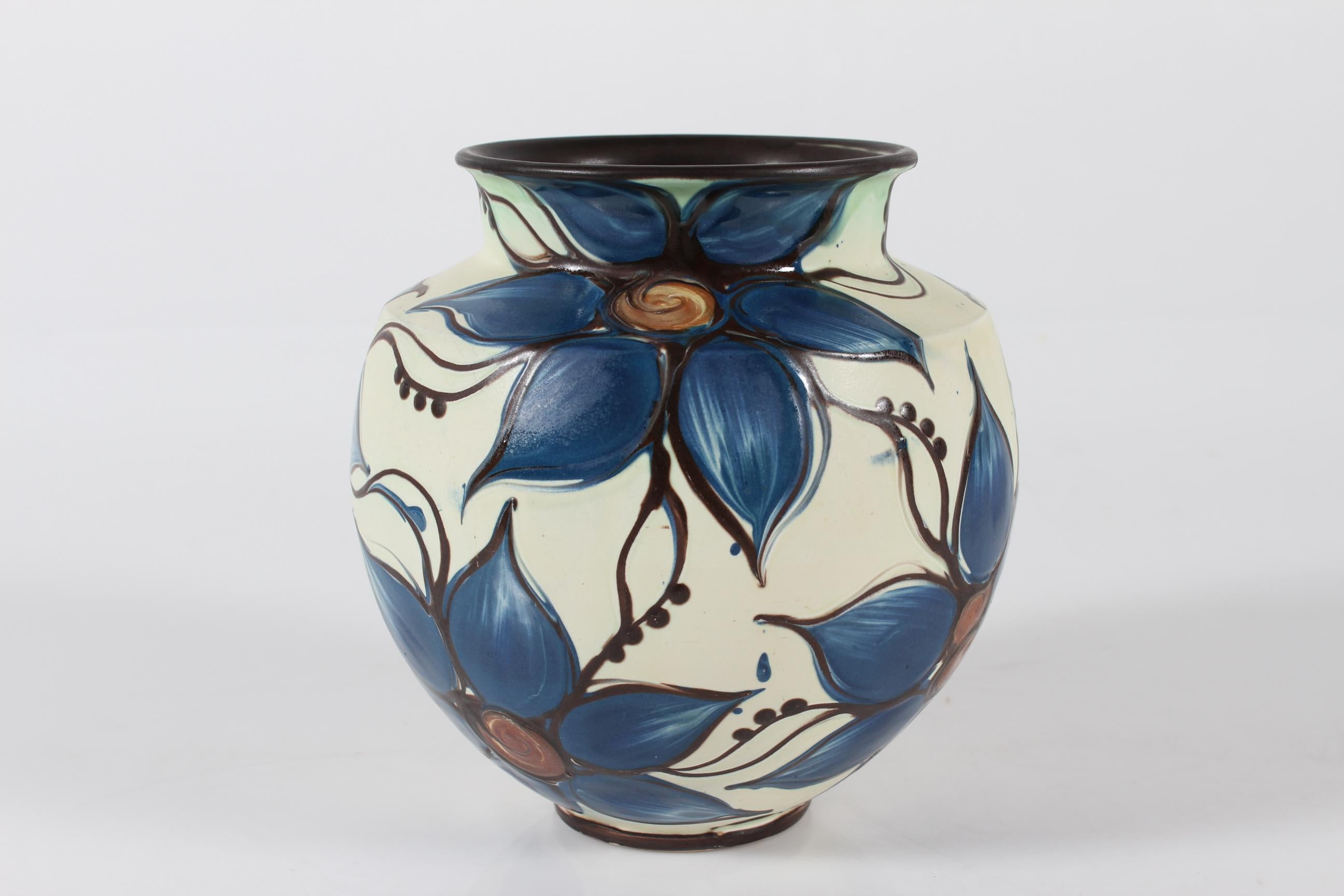 Danish Art Nouveau ceramic vase made by the workshop Herman A. Kähler in the early 20th century (1915-1925).
Floral decoration most likely by Sofie Lundstein who worked for Herman A. Kähler for decades

The vase is decorated with the difficult cow