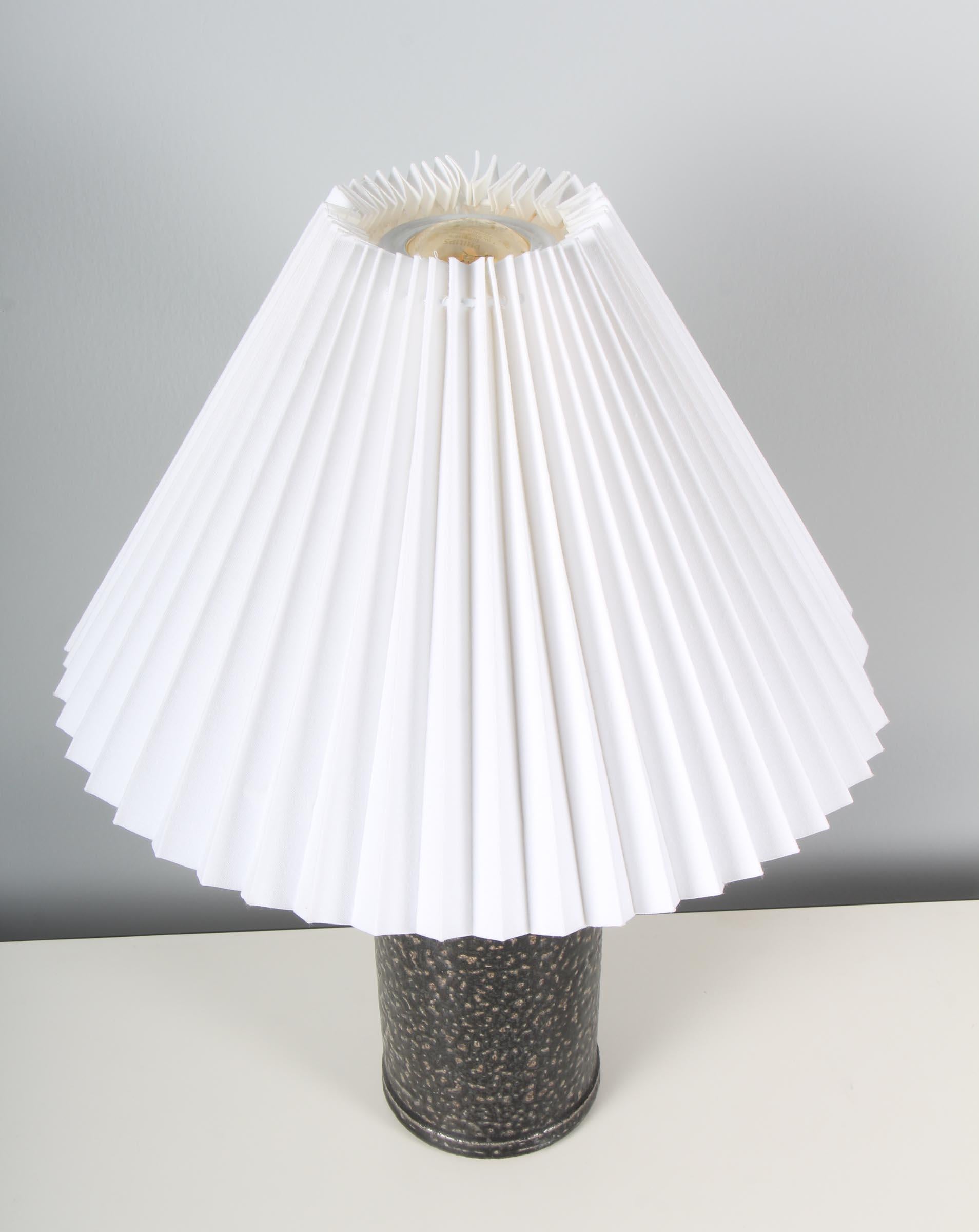 Herman A. Kähler table lamp in partly glazed ceramic.

 