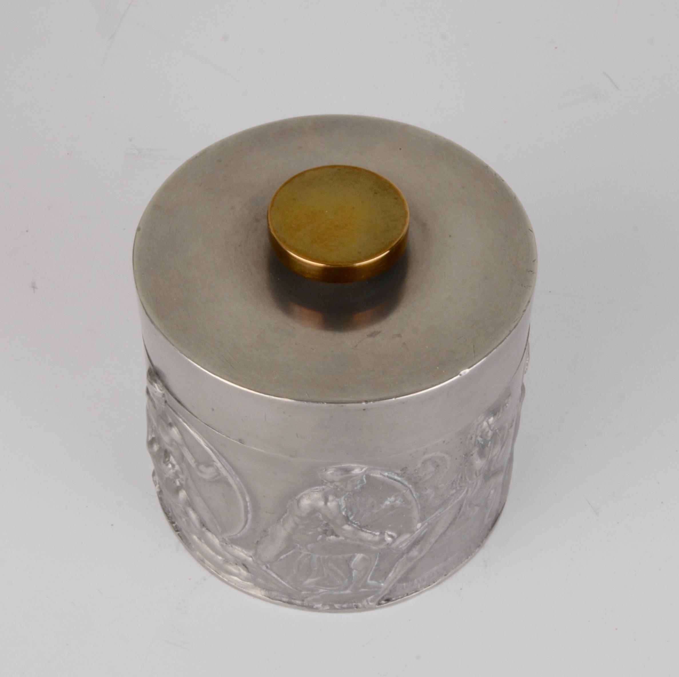 Jar in pewter and brass, with figurative motif. Made by Herman Bergman Konstguteri, Stockholm, 1940 (08).