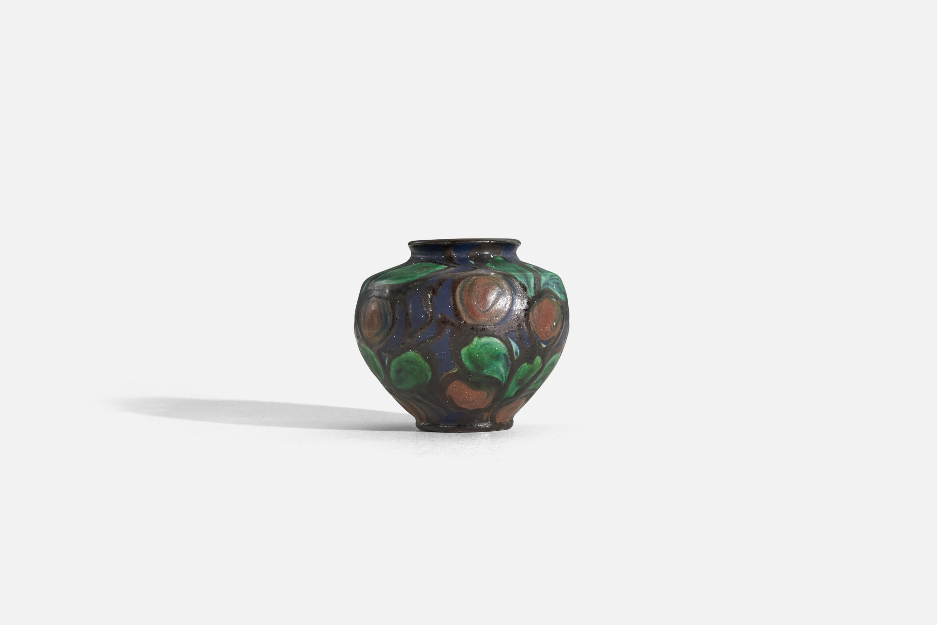 A glazed earthenware vase with a floral motif, designed and produced by Herman Kähler, Denmark, c. 1900.
  