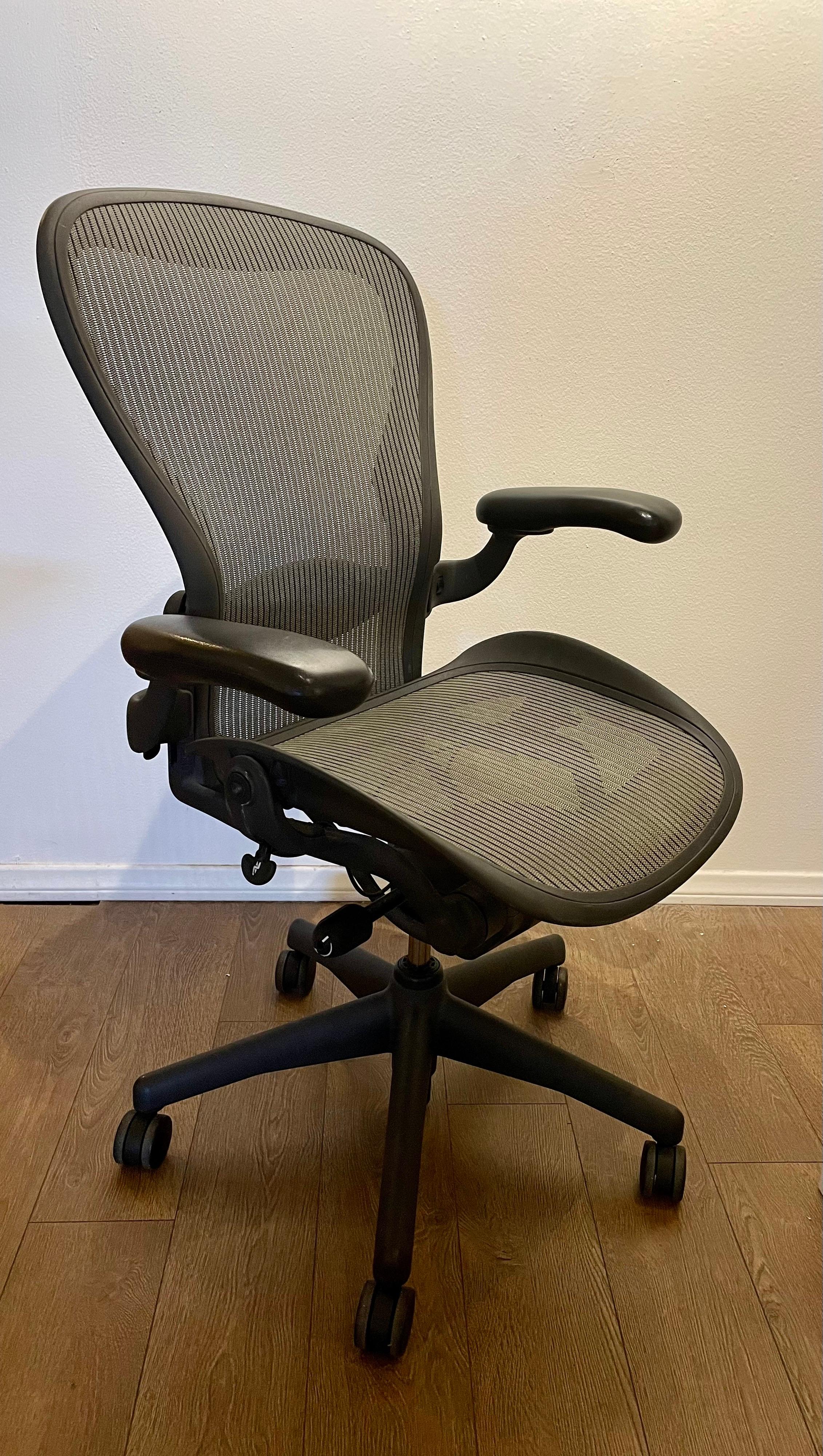 Adjustable Herman Miller Aeron chair with adjustable arms and lumbar support, great clean condition very light use.