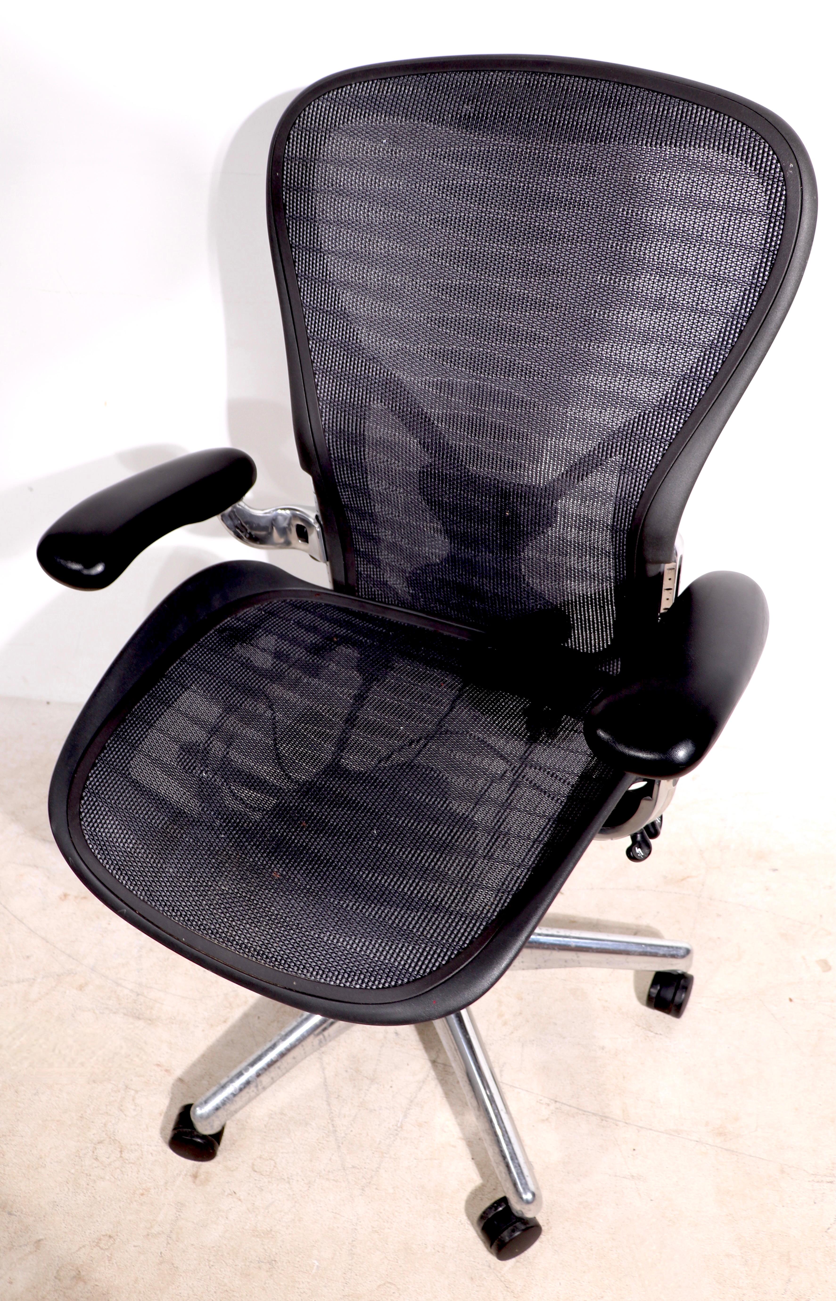 Generally the word iconic is overused and hyperbolic, but not when referring to this chair. Both classic style, and comfortable ergonomic design are evident in this Herman Miller made, Aeron swivel desk chair. 
 Fully functional, clean and ready to