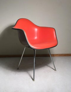 Herman Miller Charles Eames Shell Chair Is a Nice Orange on Taupe Fiberglass