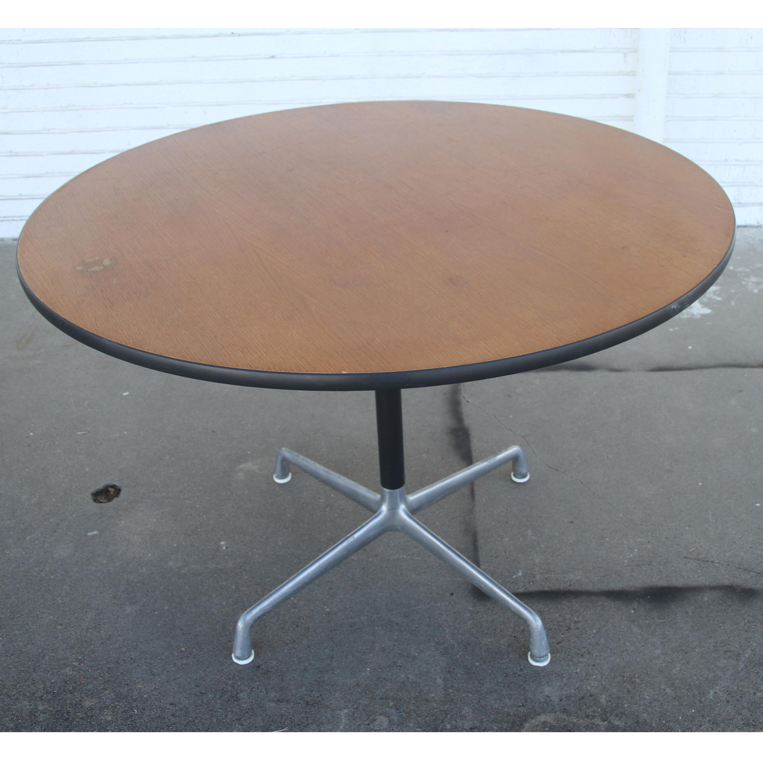 Herman Miller Eames Round Table
Herman Miller Round top with walnut finish , the base is anodized in black with aluminum spider attachment. Great in and office or a home setting .  