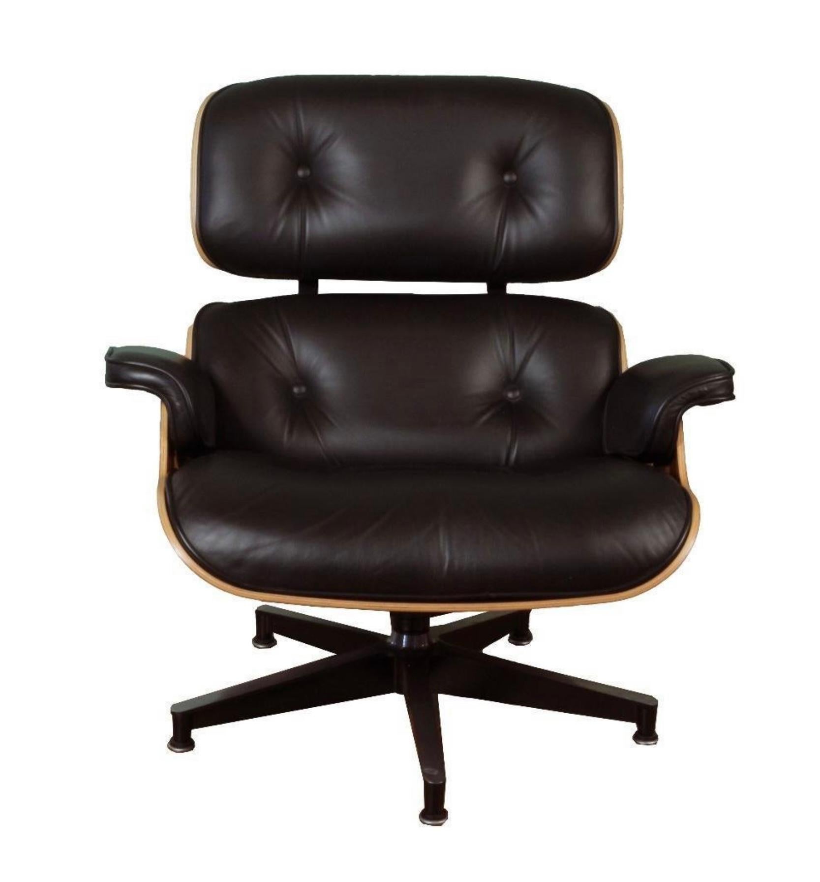 Beautiful Herman Miller Eames chair and ottoman in a beautifully grained palisander shell.  Black leather cushions. The chair has delivery dates of 4/16/202008 and 4/21/2008 on the bottom sticker. In very good overall condition, with some minor