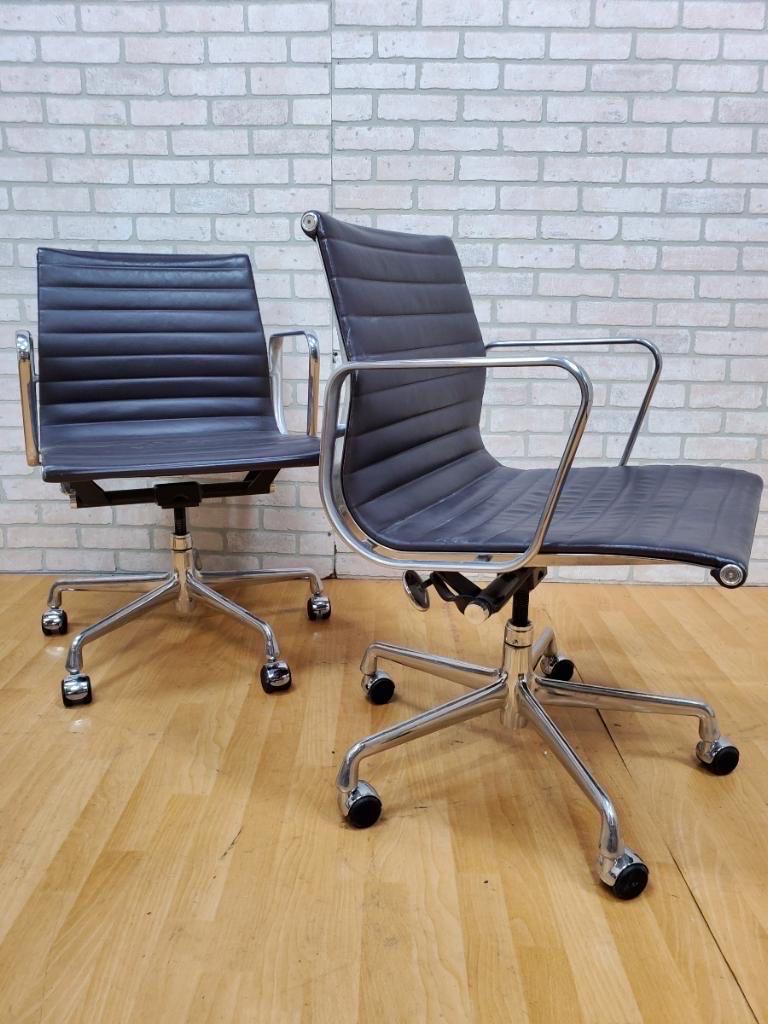 Mid-Century Modern Herman Miller Eames aluminum management group leather chair - set of 2.

A pair of mid century modern Herman Miller Eames management aluminum group desk/office/conference chairs, model ea335 in leather . These chairs features an