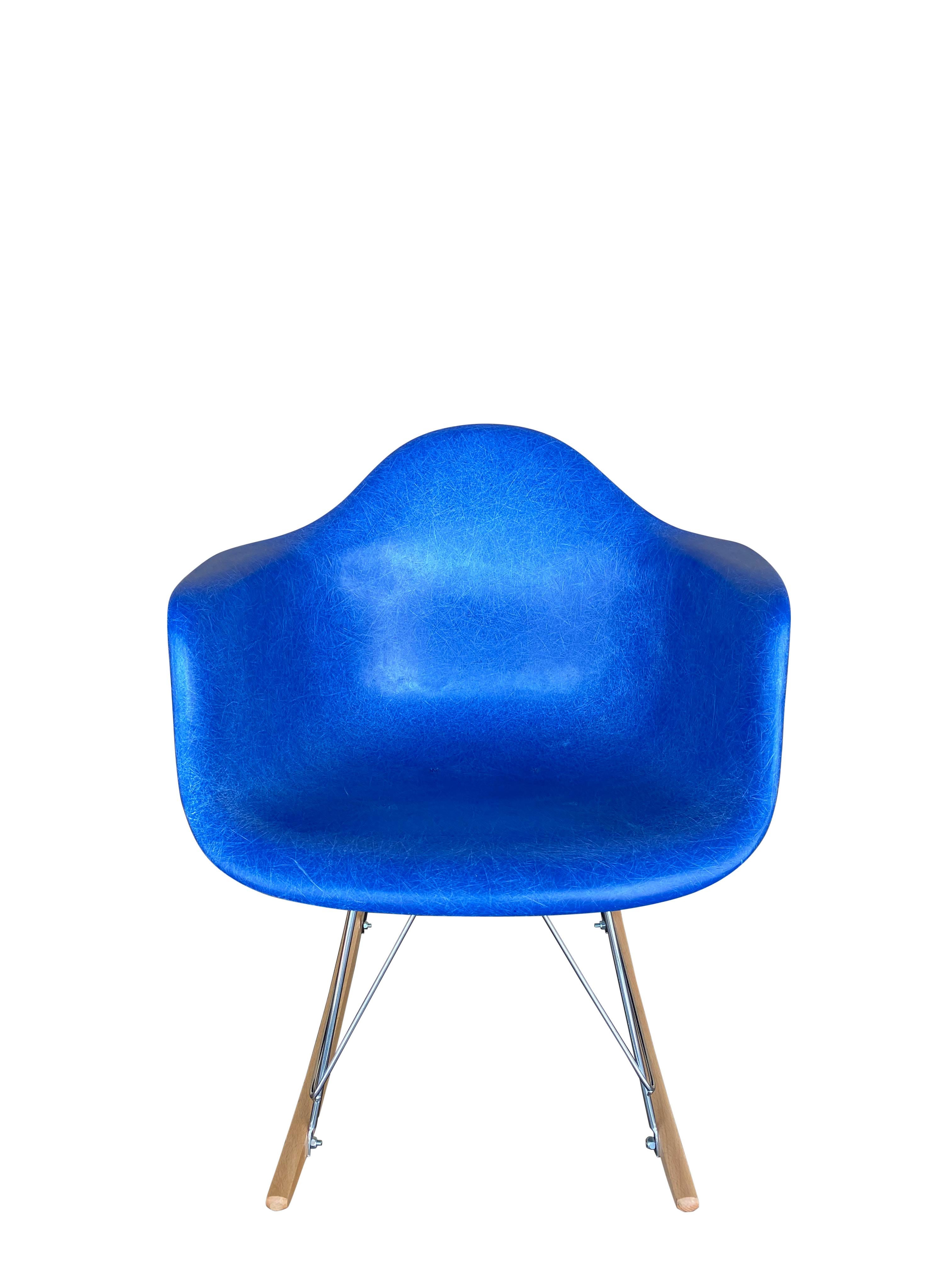 Vintage Herman Miller Eames fiberglass rocker, modern RAR. Vintage shell circa 1970s on newer rocker base. Bright and vibrant aquamarine blue shell with even color. New shock mounts installed. Signed and guaranteed authentic. No cracks or major edge