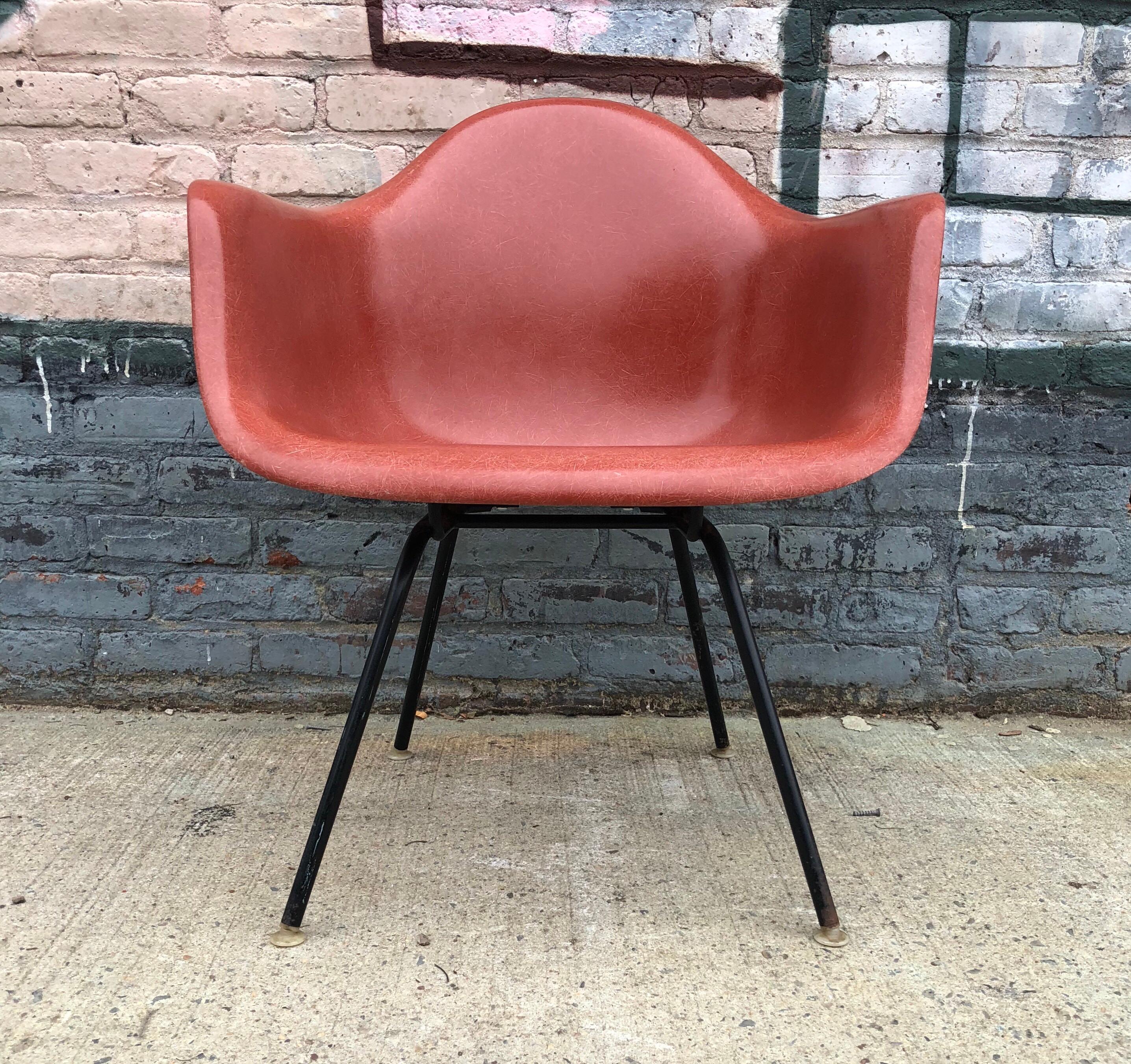 Herman Miller Eames Armshell in terra cotta. In excellent vintage condition. No cracks. On lounge base but can be hanged for dining height base at no charge. Rocker or Eiffel bases available for additional cost. Signed. From 1970s.