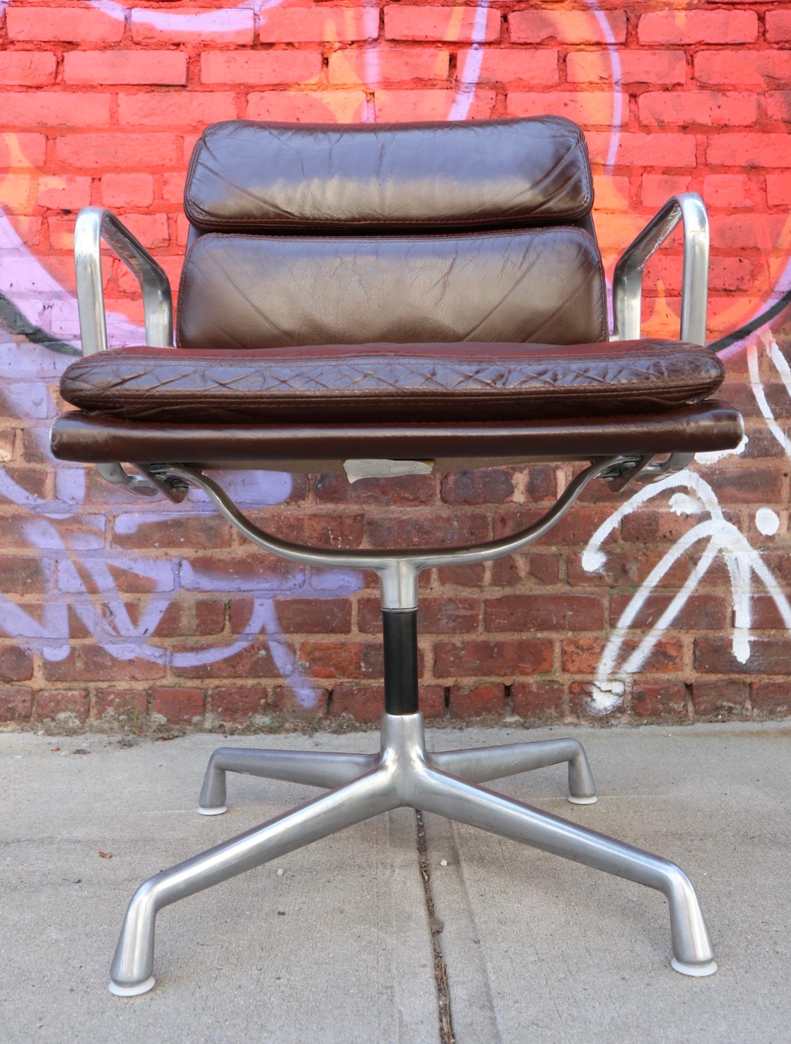 Gorgeous Classic Herman Miller soft pad management office chair. Outfitted in supple brown leather and polished aluminum, France. Chair swipes smoothly. Signed with label and embossed Herman Miller in frame.