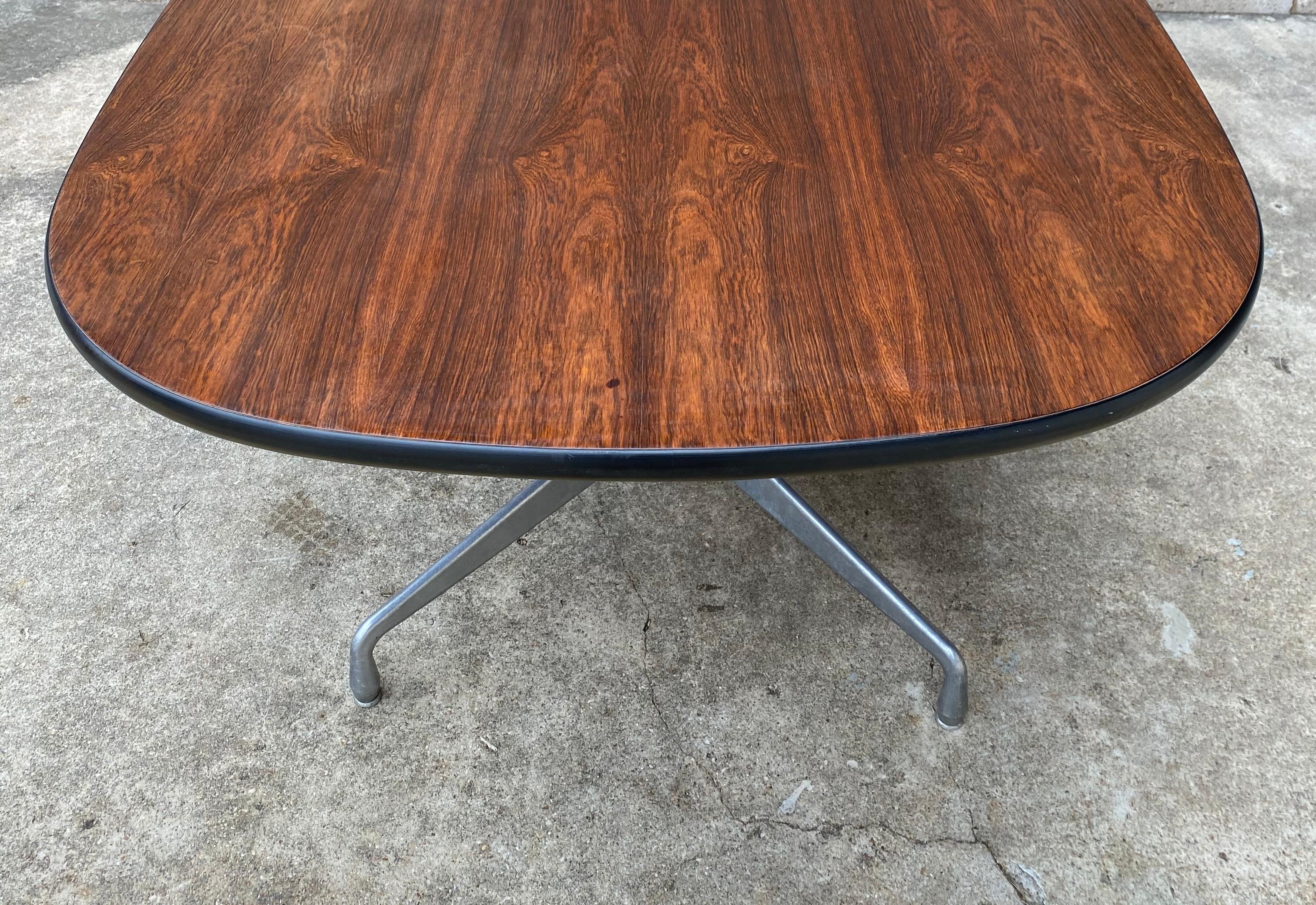 Gorgeous Eames racetrack style table by Herman Miller. Aluminum segmented base and refinished. This was a custom order at the time, and furniture these are increasingly difficult to track down. Refinishing included in price.