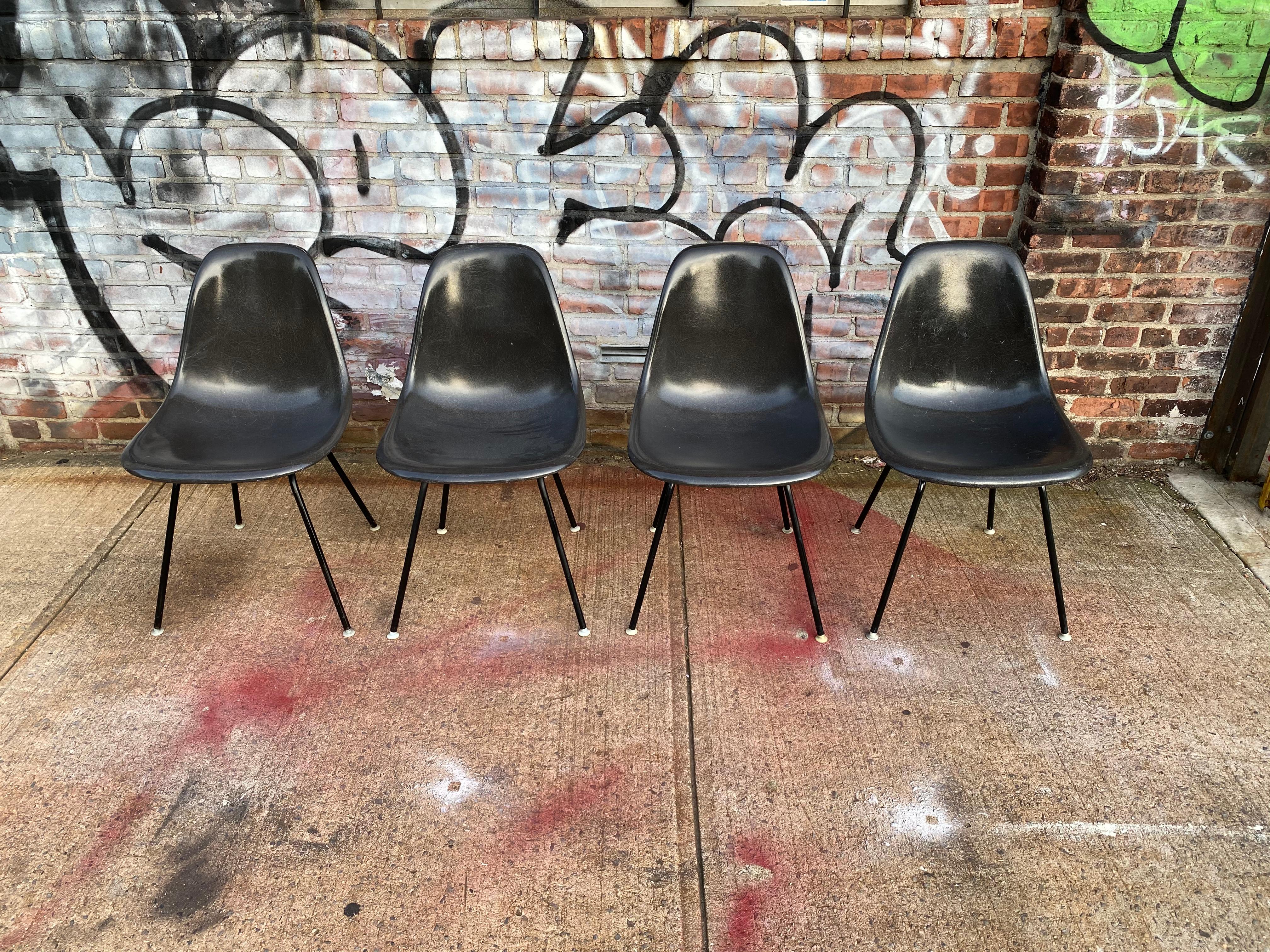 The sexiest set of Eames chairs in town. All black on black color combination. All self leveling glides present on black bases. No cracks in shells. All signed Herman Miller and guaranteed authentic. In very good condition.
