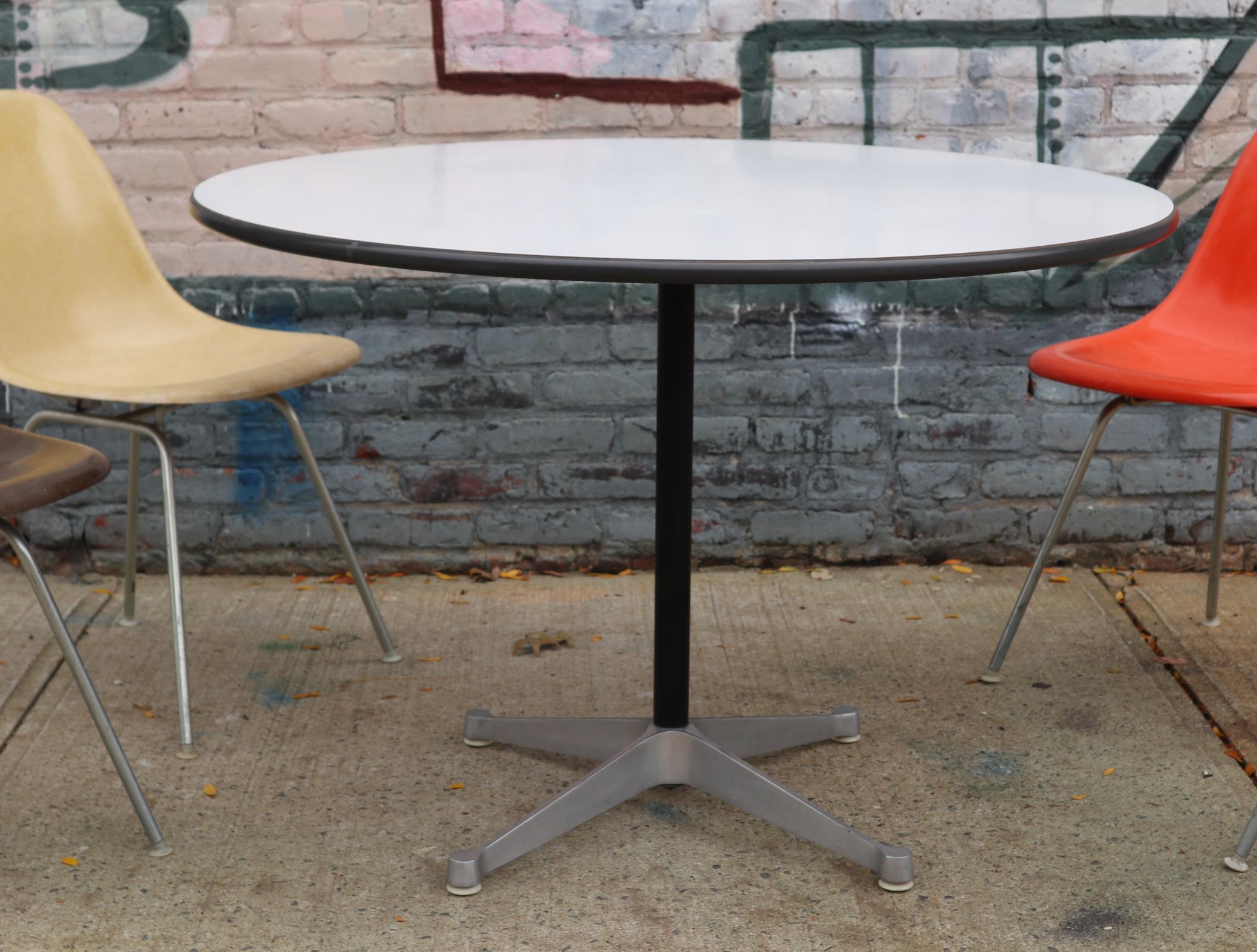 herman miller dining table and chairs