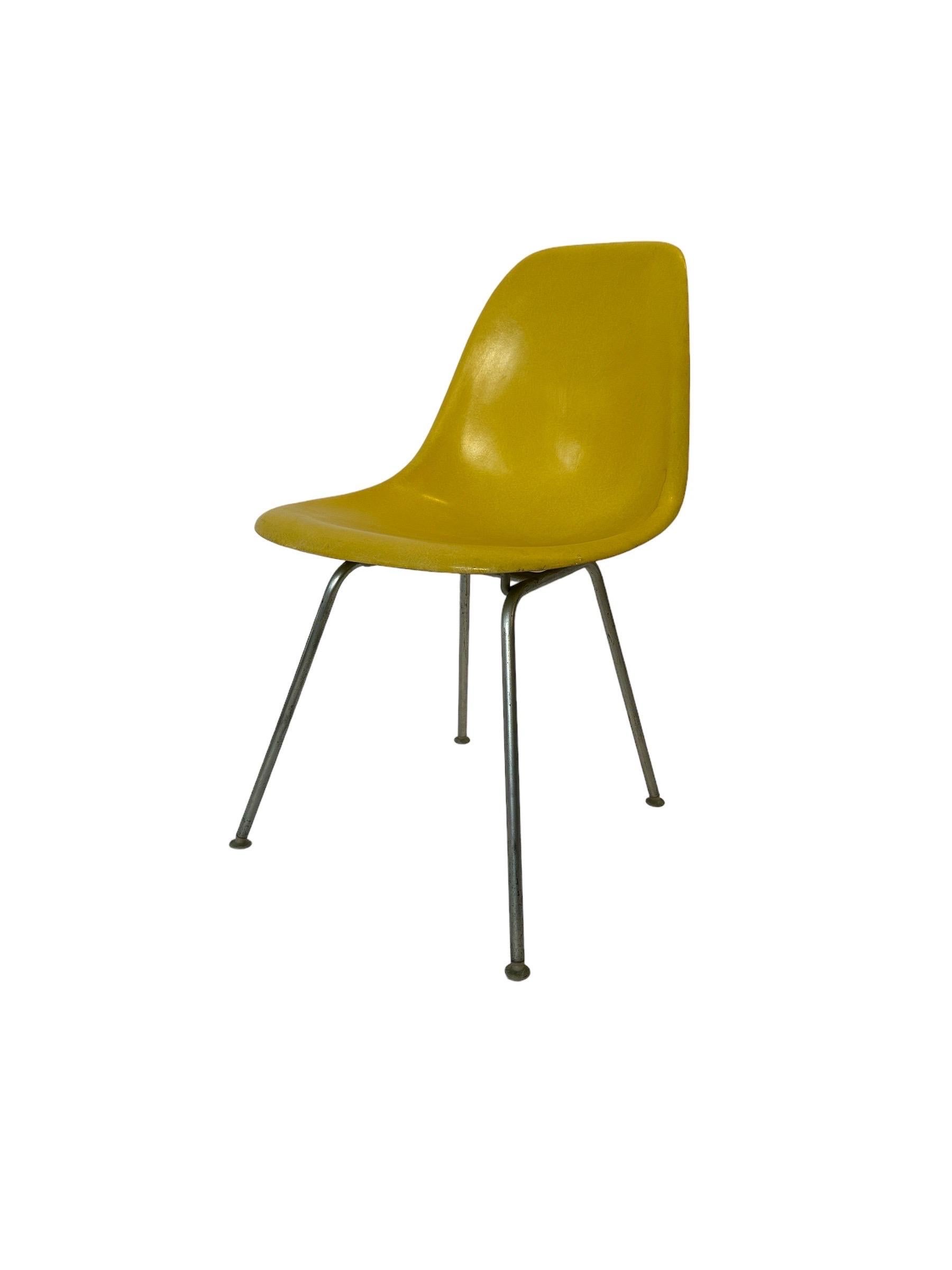 Classic Herman Miller fiberglass diamond chair. Designed by Charles and Ray Eames. circa 1970s production. Model DSX. This shade is called “Brilliant Yellow” and is one of the less common hues. Shell with all screws and feet intact. May ship