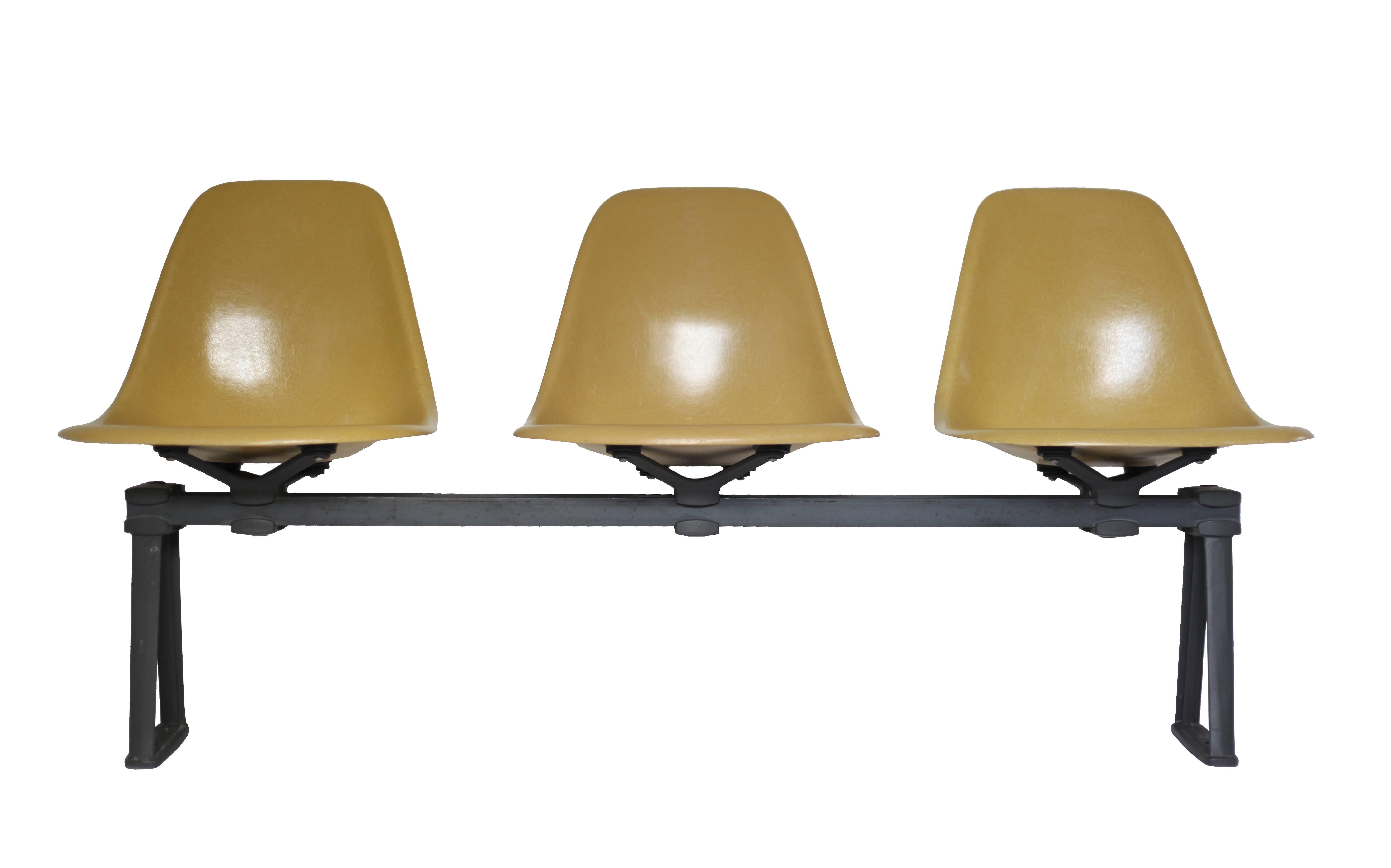 Vintage 1968 Herman Miller Ochre color fiberglass chairs on rare bench/tandem seating. The price is for 3 seats and 1 tandem base. Multiple sets are available. 6 seat tandem bases are available also. Please inquire about quantities. Comfortable,