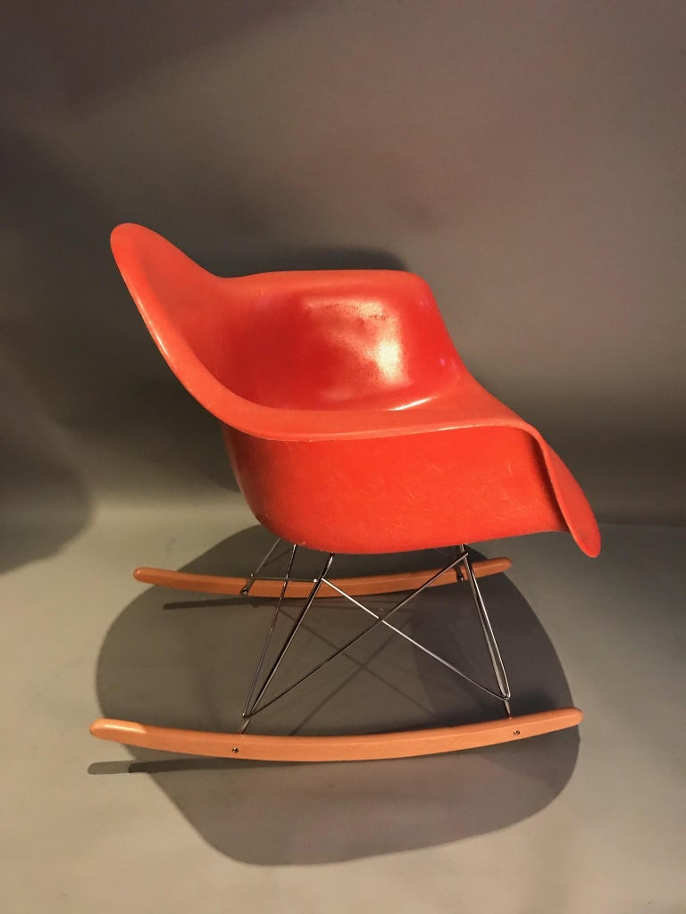 Lovely vintage Herman Miller Eames rocking chair. Model RRAR, circa 1960s shell with newer rocker base. Signed with original Herman Miller tags. Beautiful vibrant color even throughout.