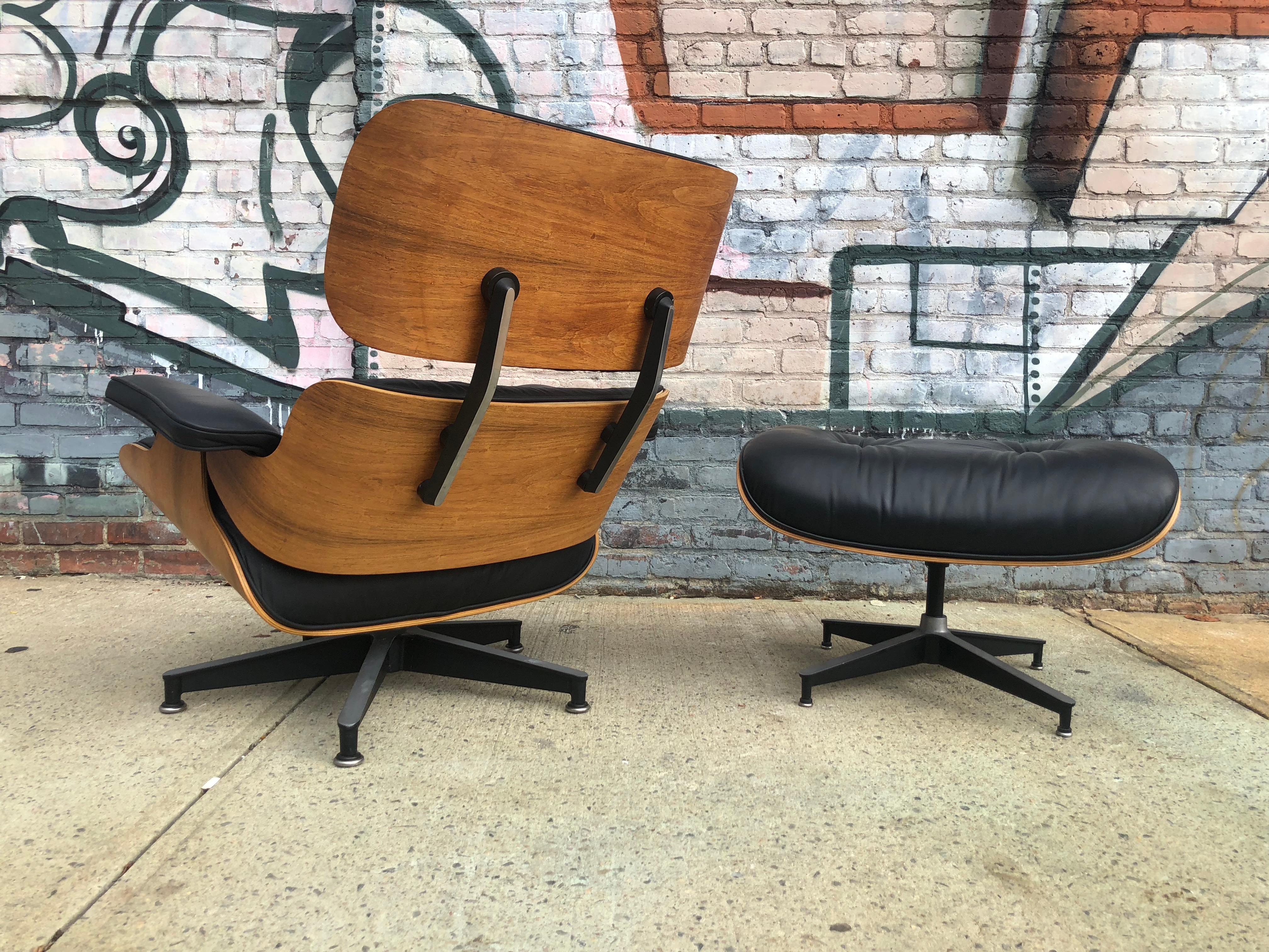 1970s edition Herman Miller Eames lounge chair and ottoman. Leather and wood immaculate. Annoriginal pait with all original leather. Signed on chair and ottoman.