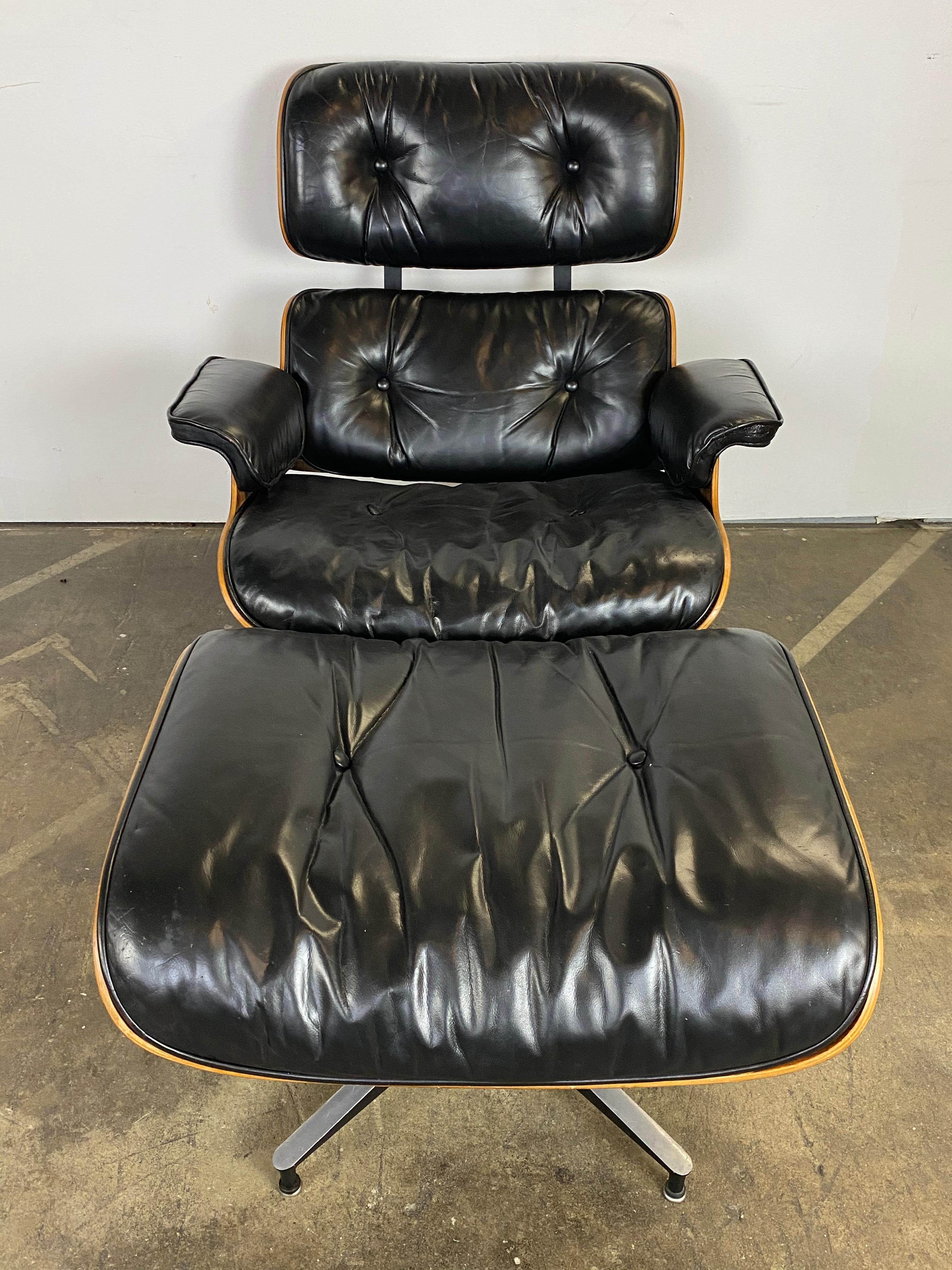 Handsome and elegant example of the modernist design Classic. This Eames lounge chair features spectacular Brazilian wood shells and black leather. The wood has been recently oiled (per Herman Miller recommendation) and displays its beautiful color