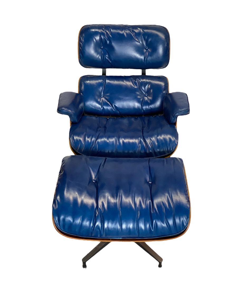 Iconic Herman Miller Eames lounge chair and ottoman. Executed in rosewoood and custom reupholstered blue leather. Not a color we have come across before. Chair has all replaced rubber shock mounts ($800 value). Chair swivels on base and chair and