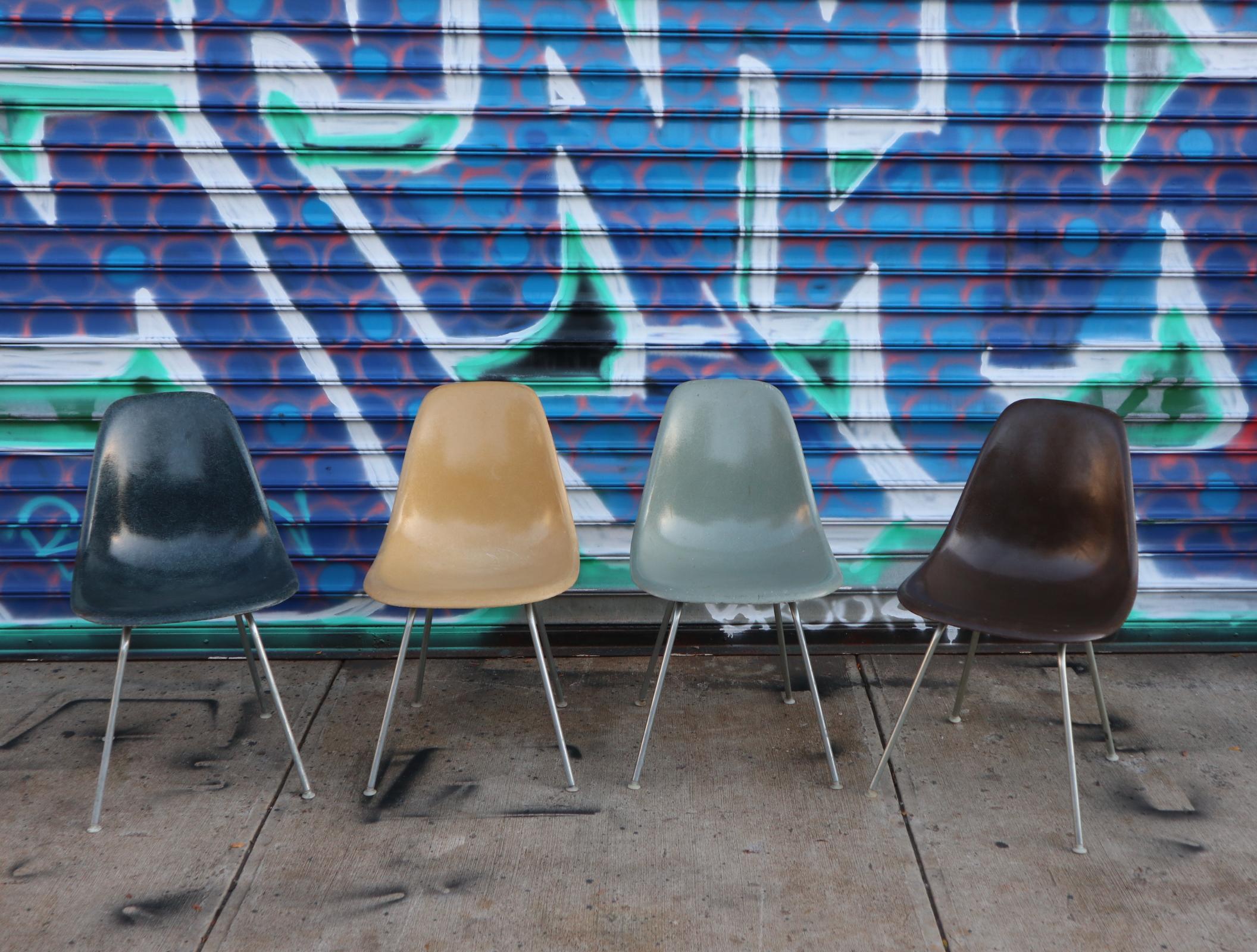Gorgeous set of 4 Herman Miller Eames fiberglass vintage dining chairs. All in great shape with norm ela vintage wear but no cracks or holes. All shock mounts and glides intact. Authentic vintage Herman Miller steel tube H bases. Colors include