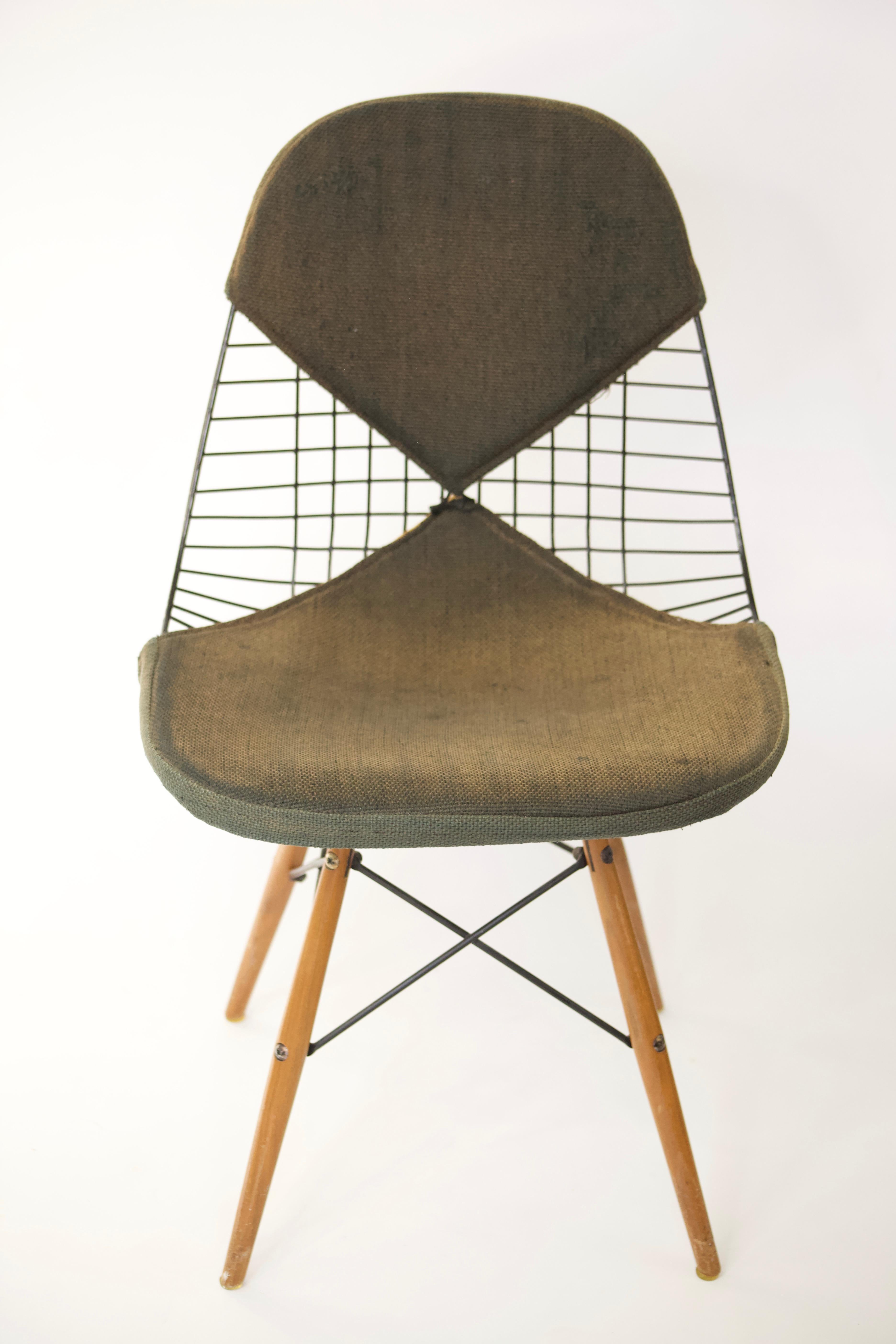 A great vintage example of one of Charles and Ray Eames many groundbreaking, iconic designs. The PKW-2 is a beautiful blend of metal, fabric and wood distilled into a functional piece of art.