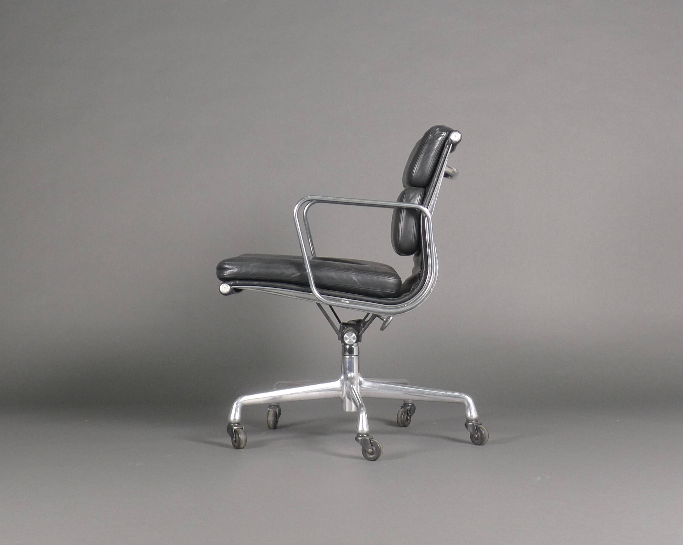 Herman Miller low back soft pad desk/office chair from the Eames Aluminium Group series, model EA435.

Black leather padded back and seat on aluminium frame and 5-star universal base on castors.  Height adjustable and with tilt and swivel
