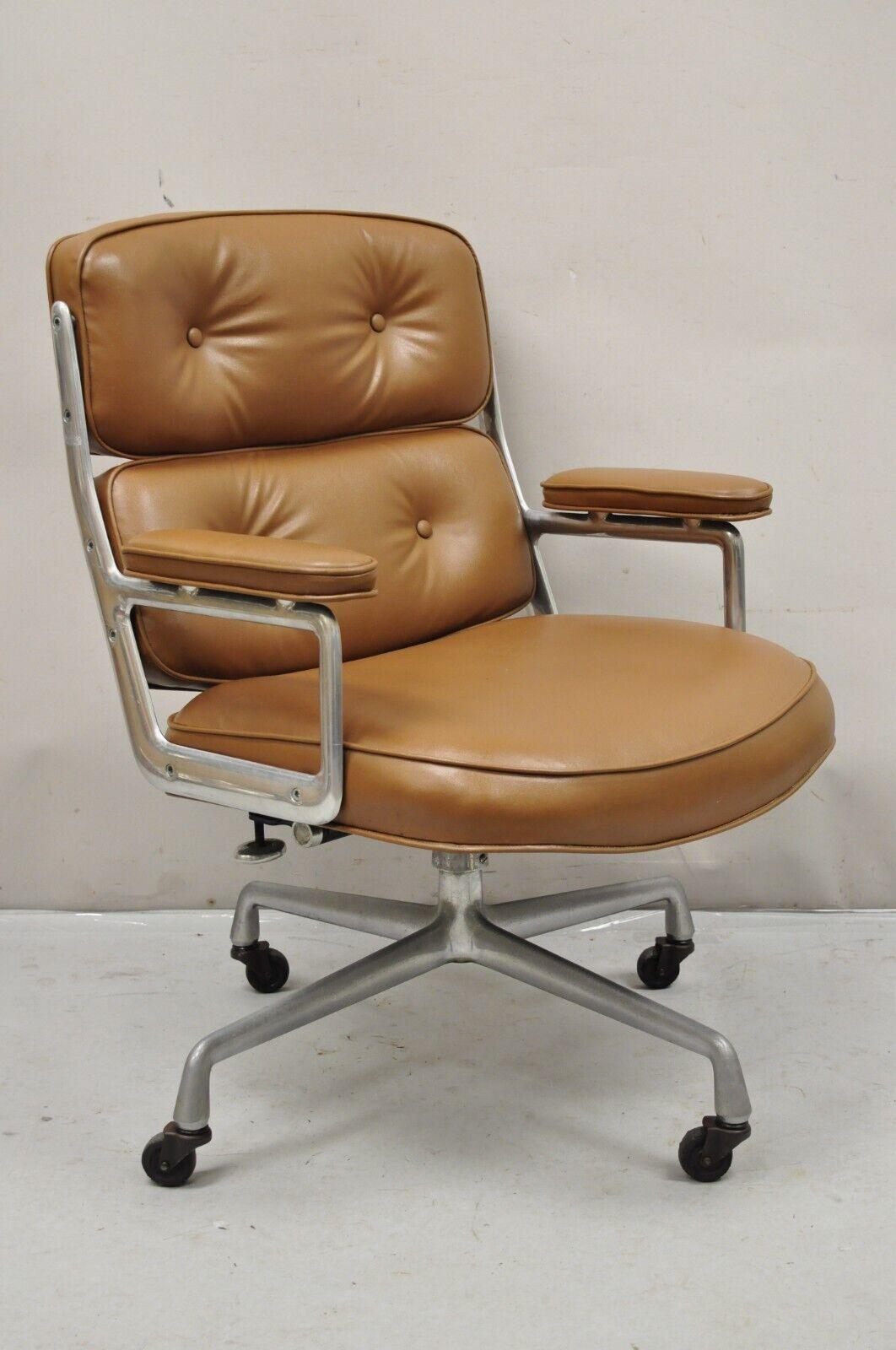 Herman Miller Eames Time Life Brown Faux Leather Rolling Office Desk Chair. Circa aluminum metal frame, adjustable height, original label, quality American craftsmanship, great style and form. Circa 960s. Measurements: 37