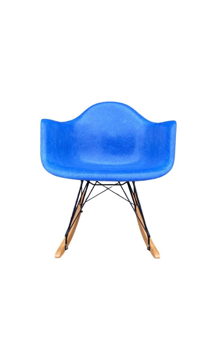 Vintage Herman Miller Eames fiberglass rocker, modern RAR. Vintage shell circa 1970s on newer rocker base. Bright and vibrant aquamarine blue shell with even color. New shock mounts installed. Signed and guaranteed authentic. No cracks or major edge