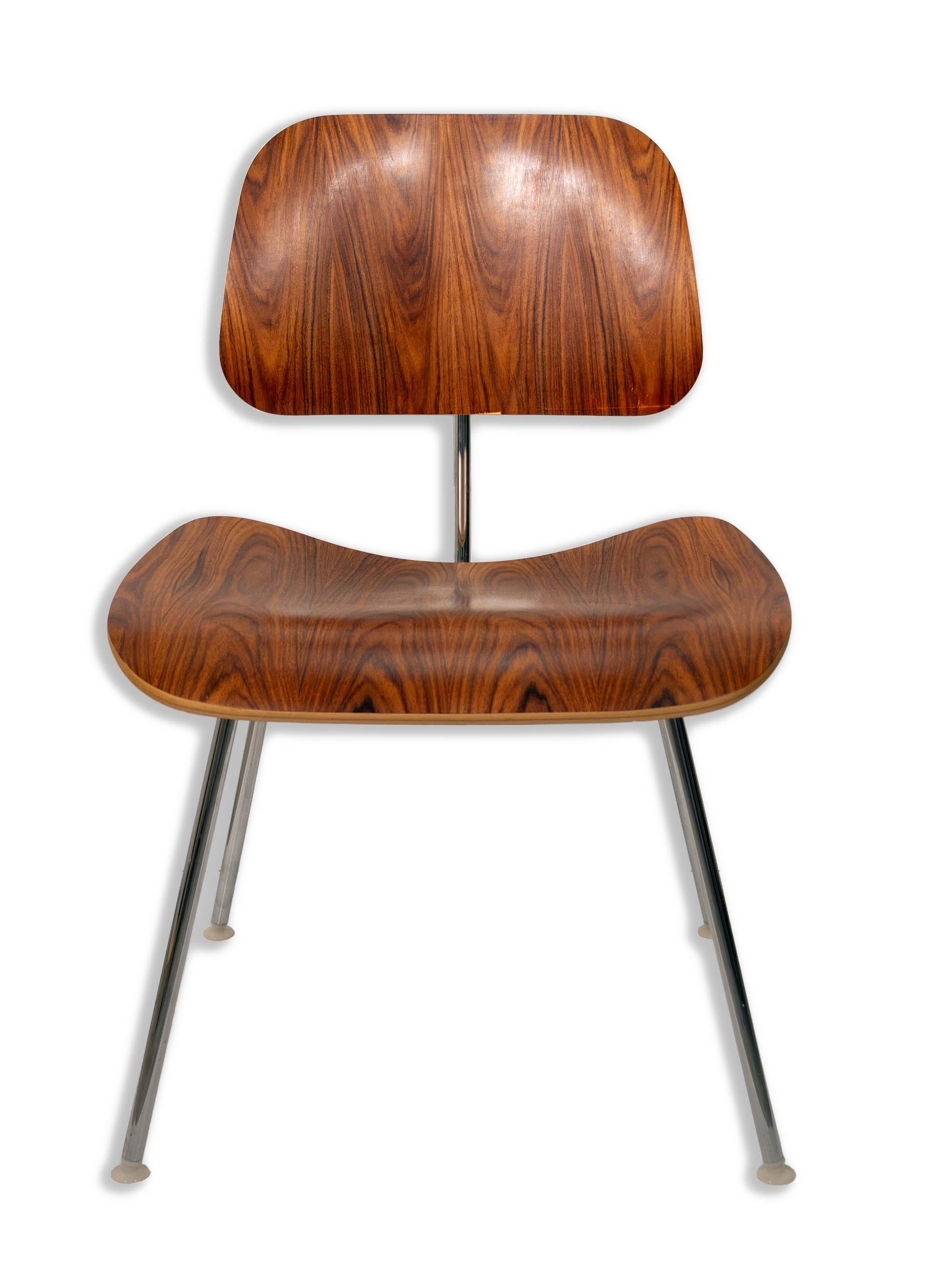You could be the proud owner of this iconic Herman Miller for Eames DCW chair in Rosewood. Made of rosewood, this already gives this chair an extra rarity boost. It's iconic design as well is something that would be super hard to pass up; sturdy,