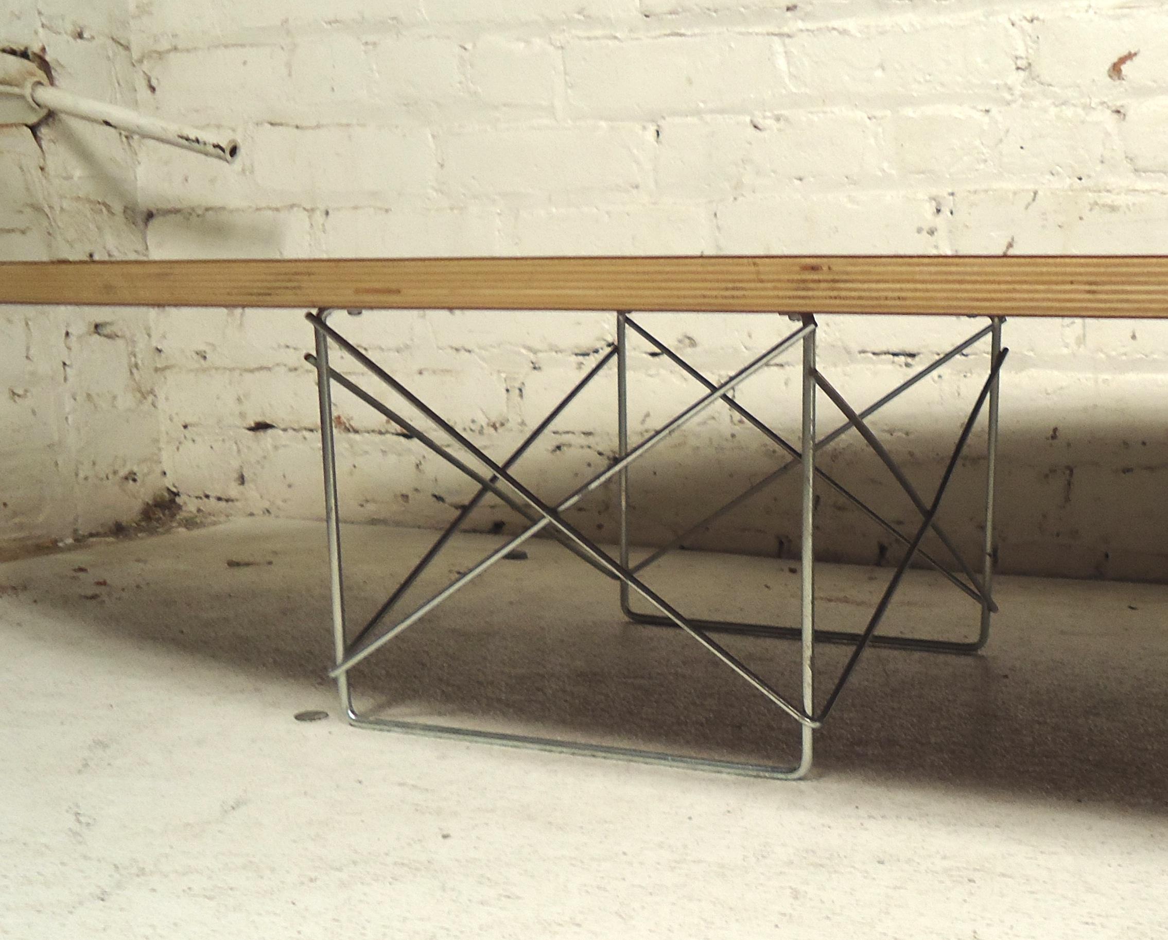 Mid-Century Modern black top coffee table with Eiffel metal base.

(Please confirm item location - NY or NJ - with dealer).
 