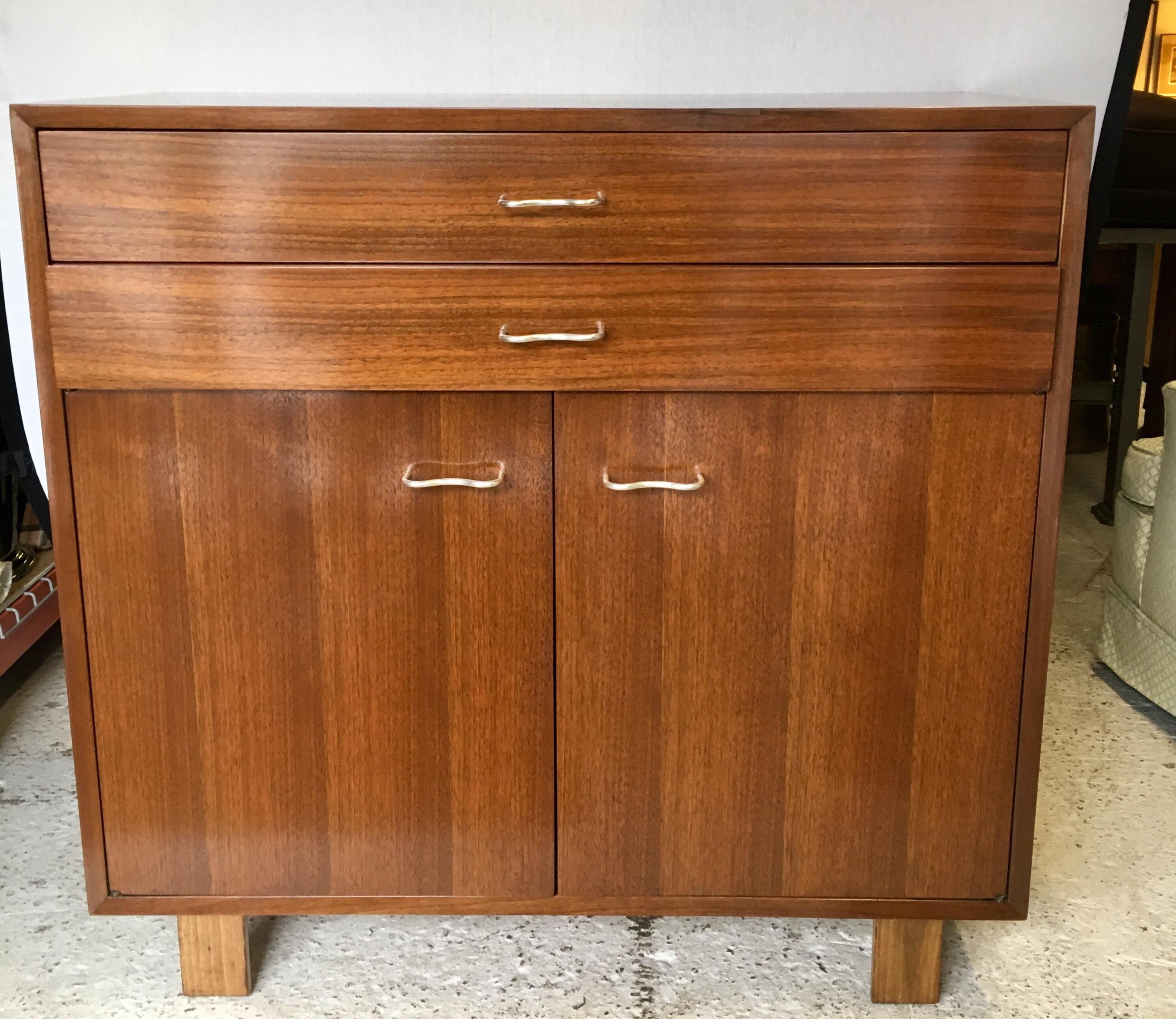 Rare George Nelson designed classic for Herman Miller, circa 1952. Features the original, coveted squiggly hardware. One of three case pieces of this set that we are selling this week exclusively on our 1stdibs platform.