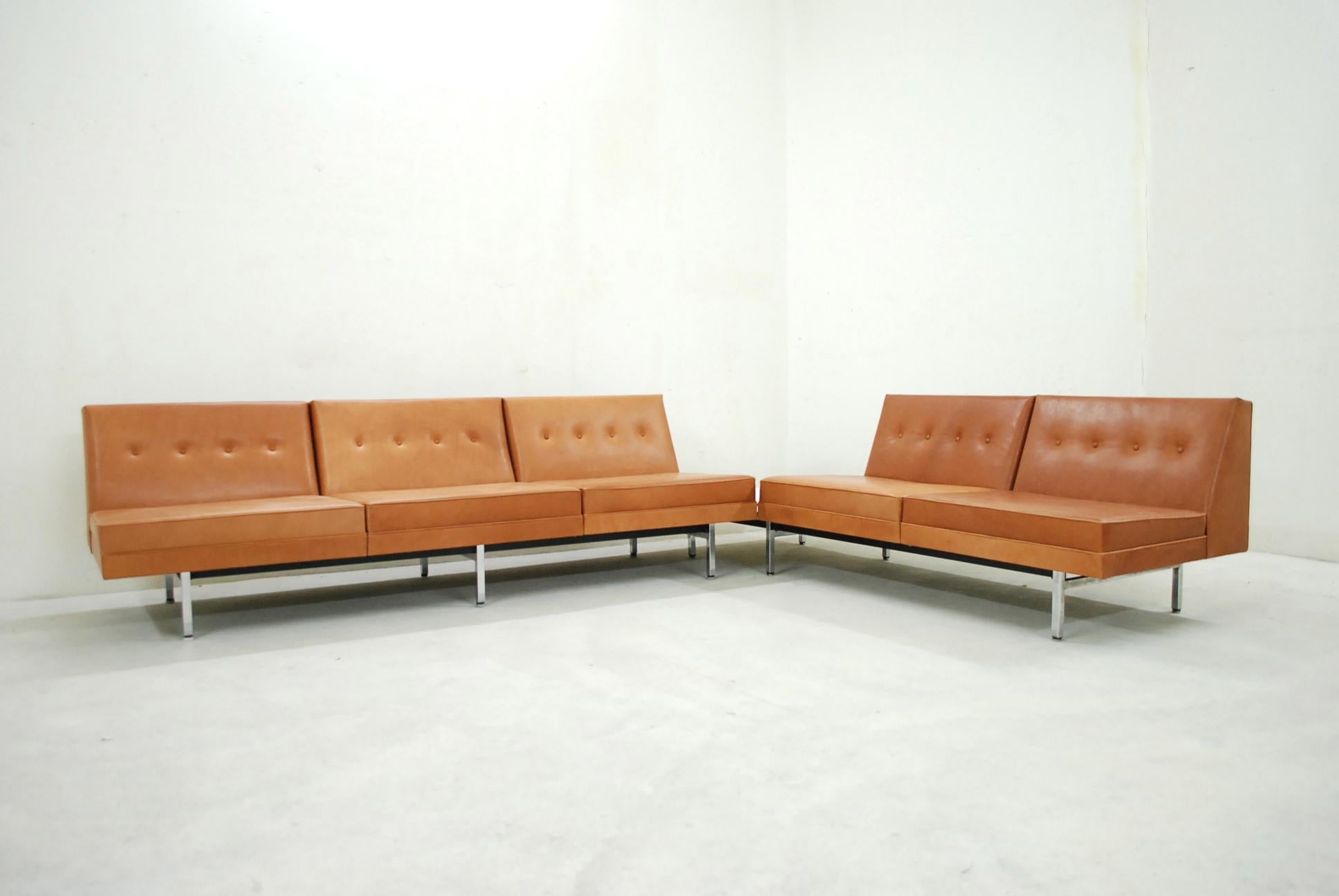 This living room set model modular sofa was designed by George Nelson for Herman Miller.
This set was completely re -upholstered in high premium cognac Natural leather.
It has a soft leather touch.
The frame is made of chrome steel and black