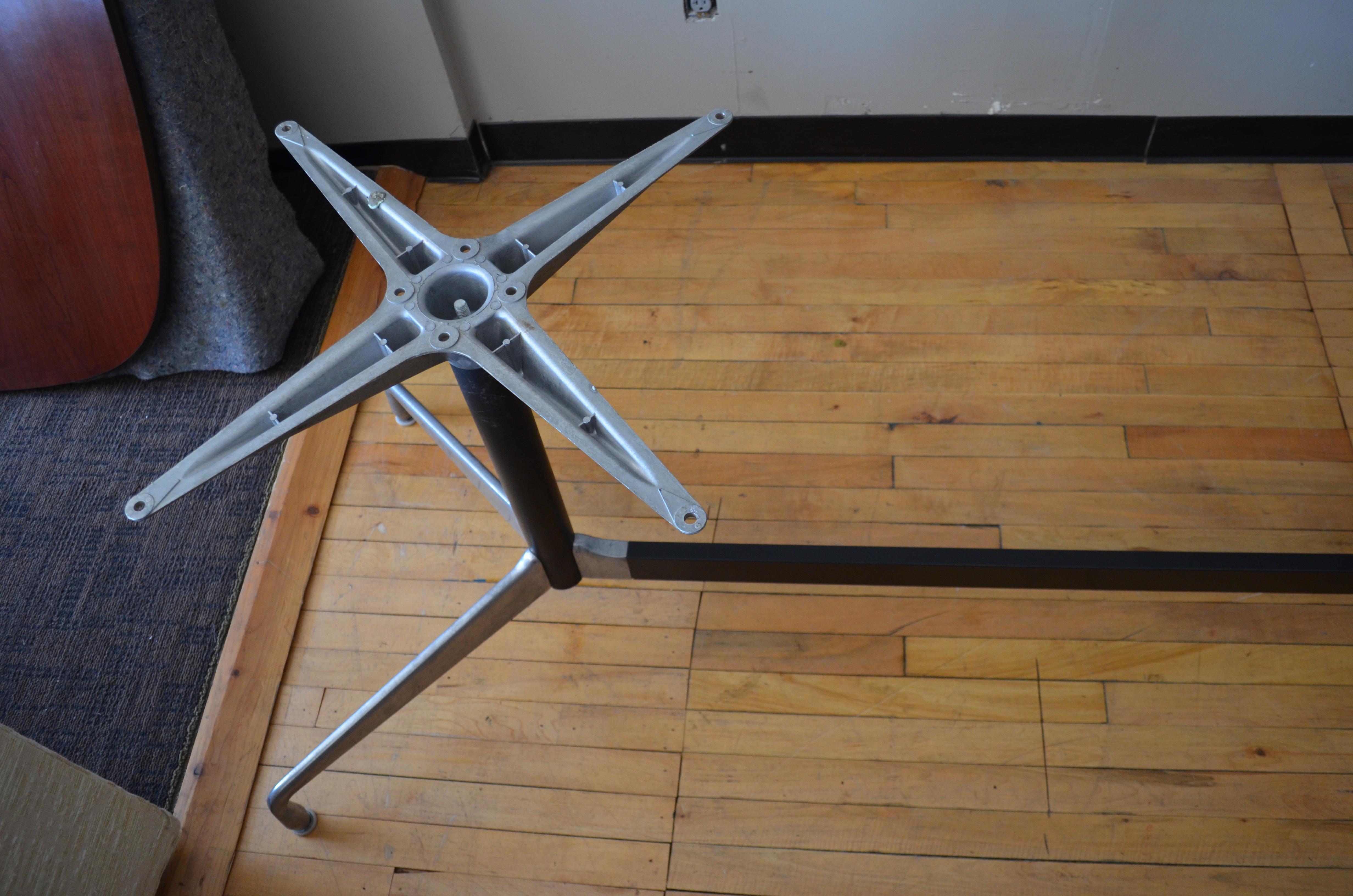 Herman Miller segmented conference table with aluminum base. Thirteen feet long. A Classic of the midcentury philosophy whereby design combines function and Minimalist style to create pieces that resonate with both. With this segmented design, one