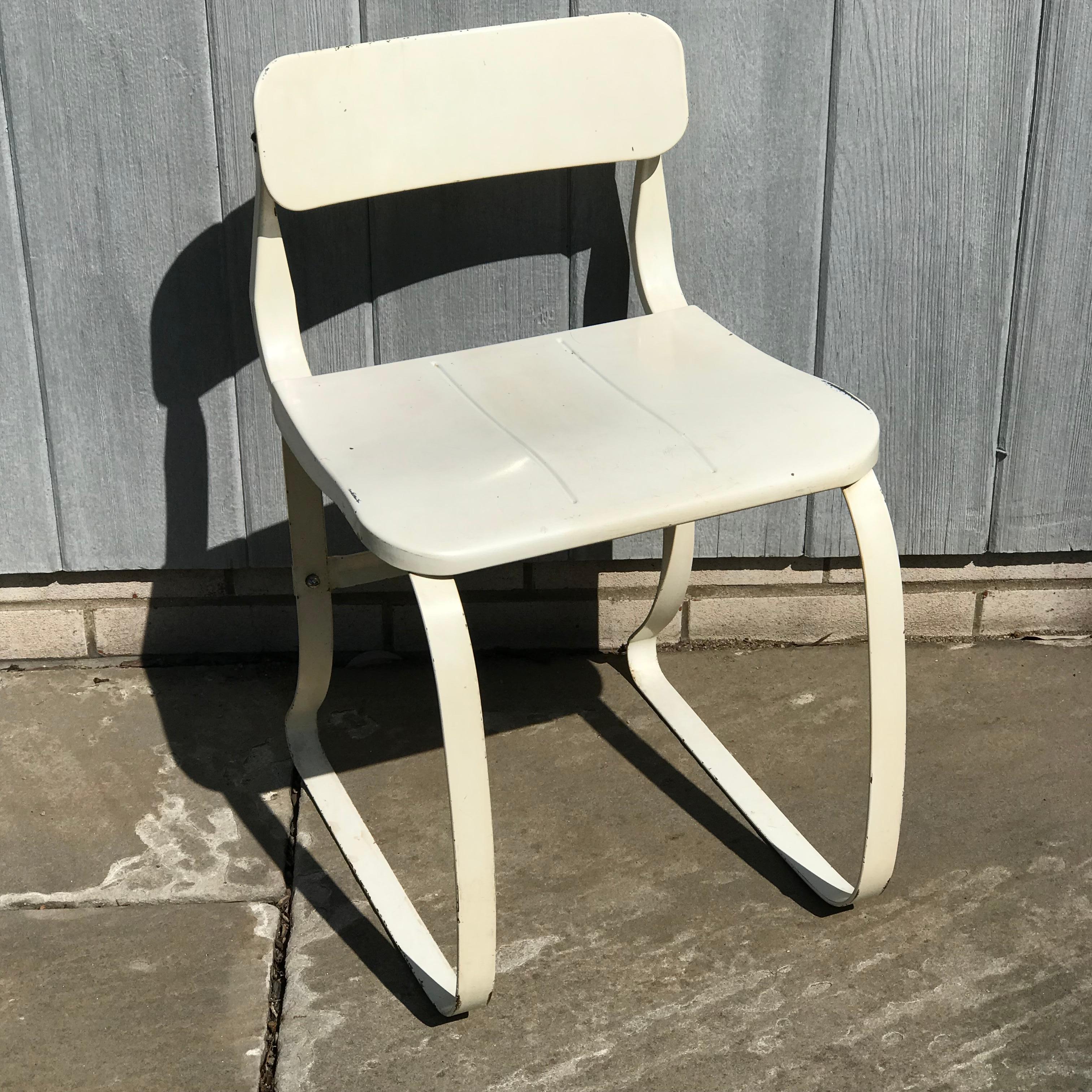 An unusual Ironrite Health Chair designed by Herman Sperlich in a lovely white enameled steel frame and seat.